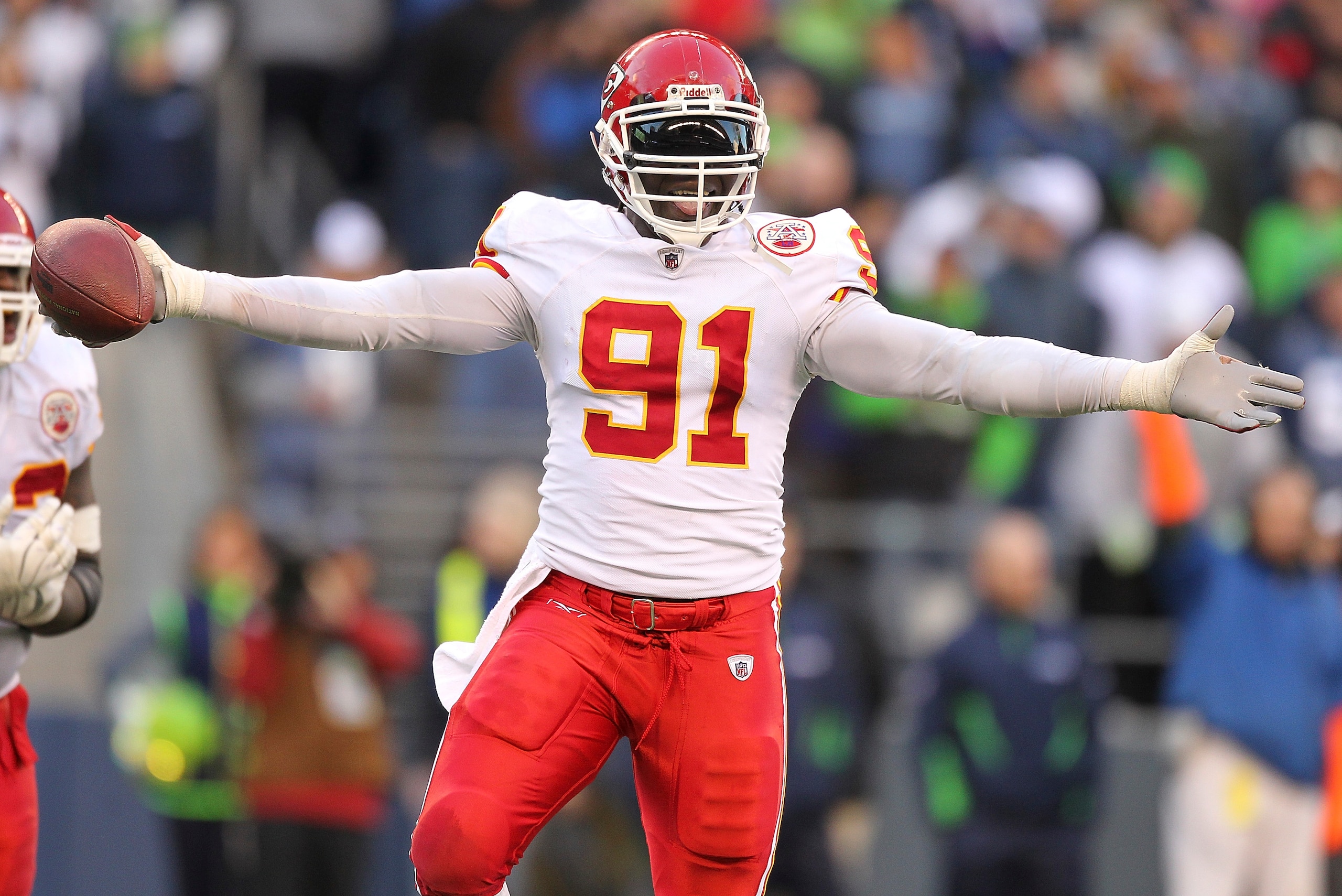 SEATTLE - NOVEMBER 28:  Linebacker Tamba Hali #91 of the Kansas City Chiefs celebrates after recovering a fumble on a sack of quarterback Matt Hasselbeck of the Seattle Seahawks at Qwest Field on November 28, 2010 in Seattle, Washington. (Photo by Otto Gr