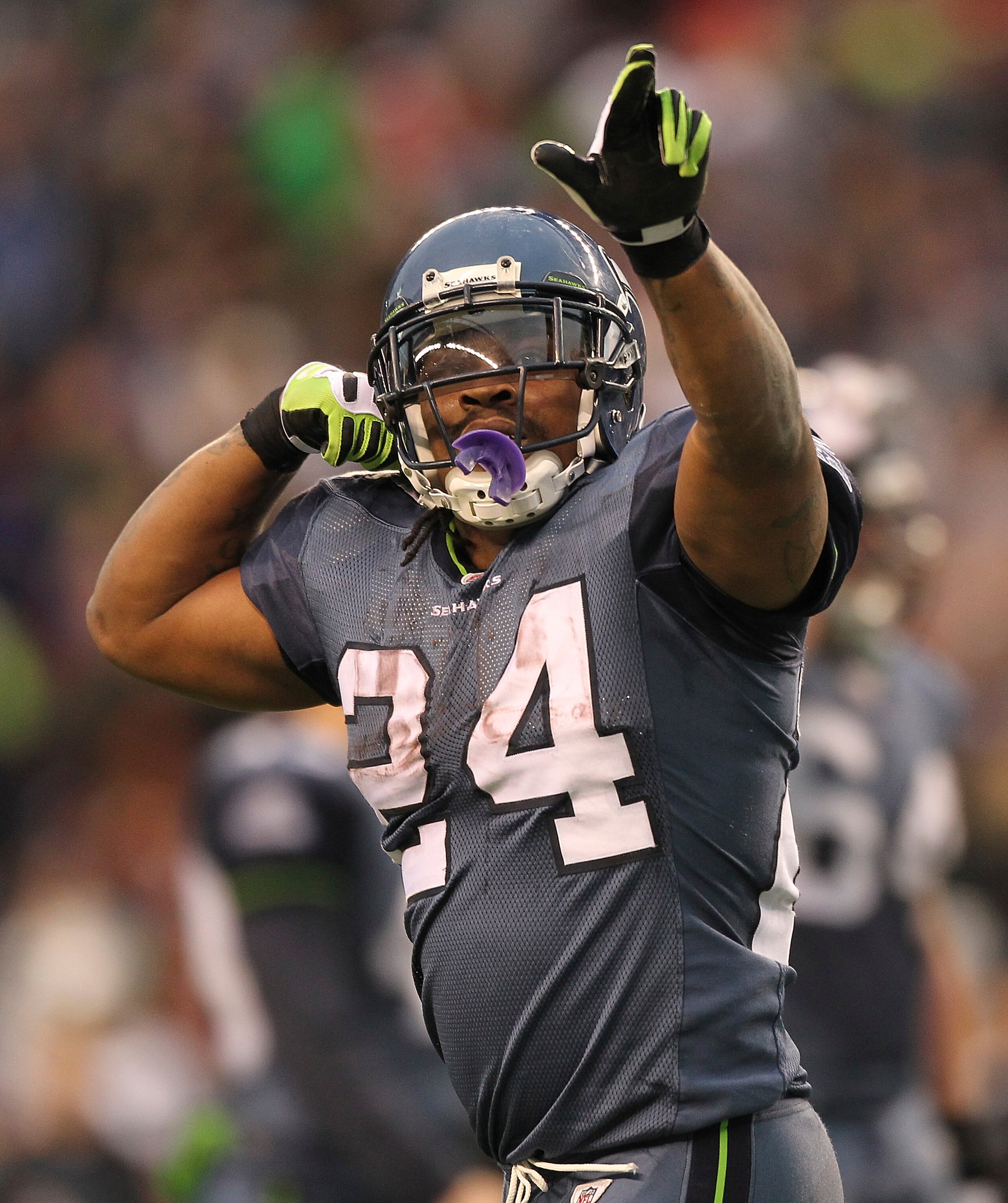 SEATTLE, WA - DECEMBER 05: Running back Marshawn Lynch #24 of the Seattle Seahawks celebrates after scoring a touchdown in the fourth quarter against the Carolina Panthers at Qwest Field on December 5, 2010 in Seattle, Washington. The Seahawks defeated t SEATTLE, WA - DECEMBER 05: Running back Marshawn Lynch #24 of the Seattle Seahawks celebrates after scoring a touchdown in the fourth quarter against the Carolina Panthers at Qwest Field on December 5, 2010 in Seattle, Washington. The Seahawks defeated t