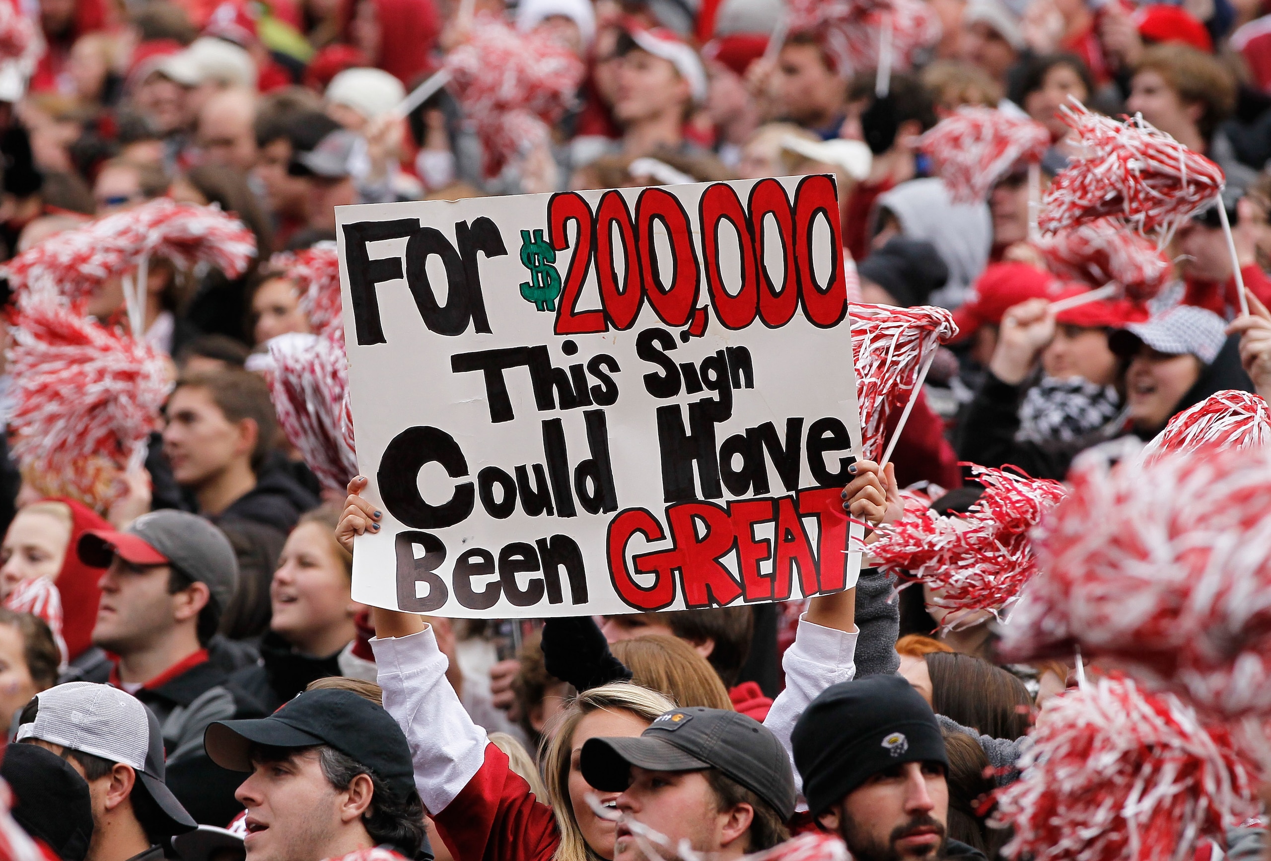 TUSCALOOSA, AL - NOVEMBER 26:  A fan of the Alabama Crimson Tide holds up a sign during the game against the Auburn Tigers at Bryant-Denny Stadium on November 26, 2010 in Tuscaloosa, Alabama.  (Photo by Kevin C. Cox/Getty Images)