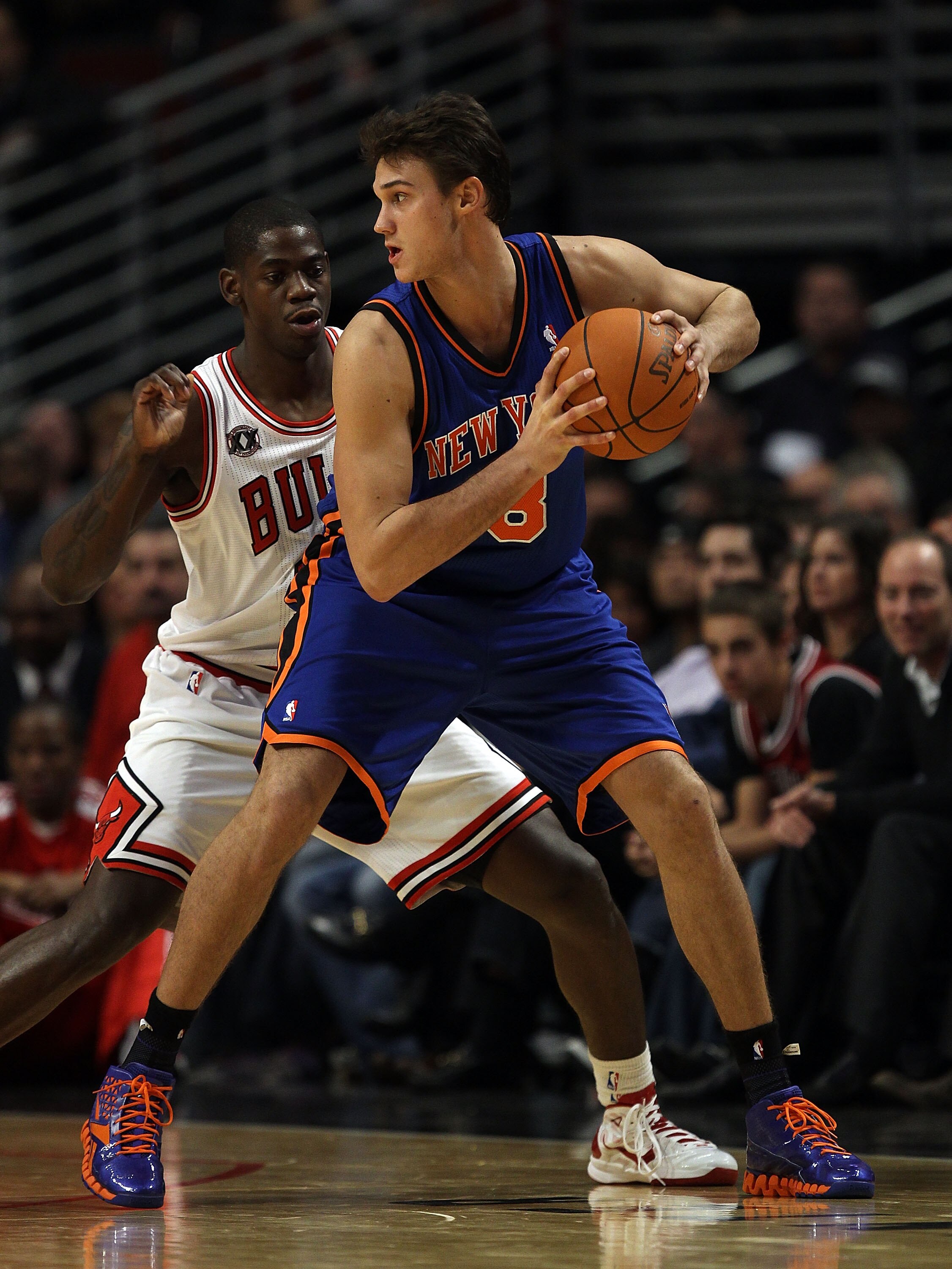 CHICAGO - NOVEMBER 04: Danilo Gallinari #8 of the New York Knicks looks to pass under pressure from Ronnie Brewer #11 of the Chicago Bulls at the United Center on November 4, 2010 in Chicago, Illinois. The Knicks defeated the Bulls 120-112. NOTE TO USER: