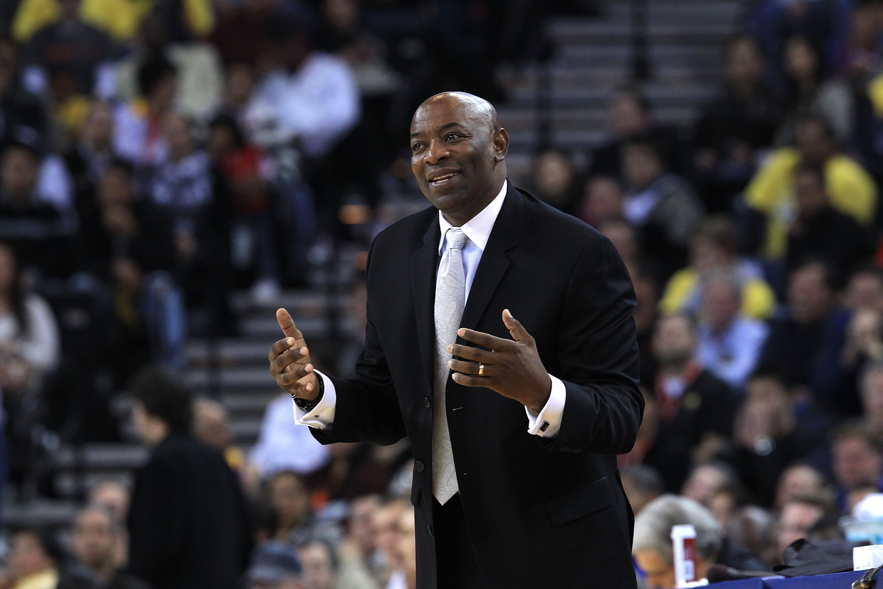 OAKLAND, CA - DECEMBER 02:  Head coach Keith Smart of the Golden State Warriors shouts to his team during their game against the Phoenix Suns at Oracle Arena on December 2, 2010 in Oakland, California. NOTE TO USER: User expressly acknowledges and agrees