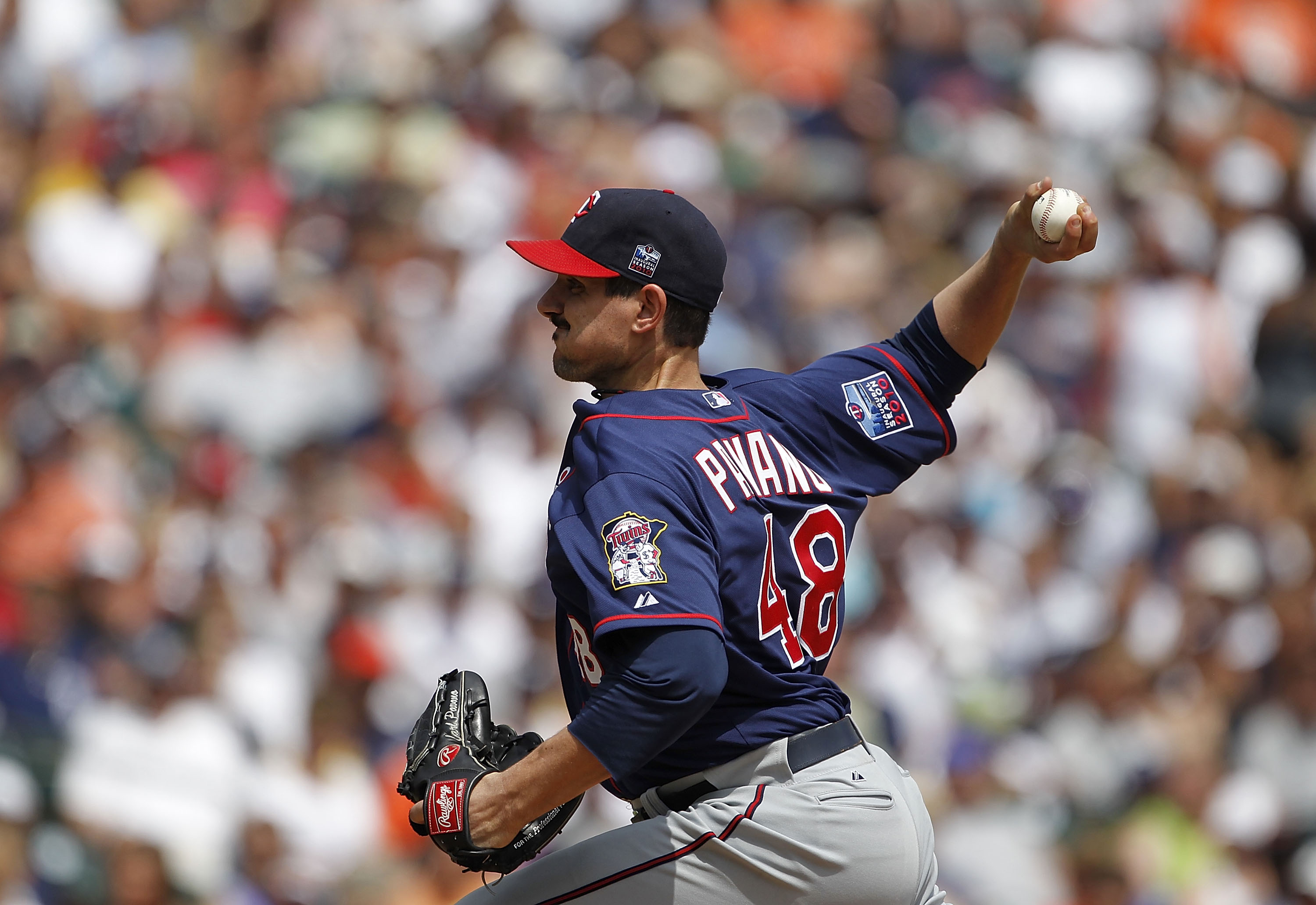DETROIT - JULY 11:  Carl Pavano #48 of the Minnesota Twins pitches in the third inning during the game against the Detroit Tigers on July 11, 2010 at Comerica Park in Detroit, Michigan. The Twins defeated the Tigers 6-3. (Photo by Leon Halip/Getty Images)