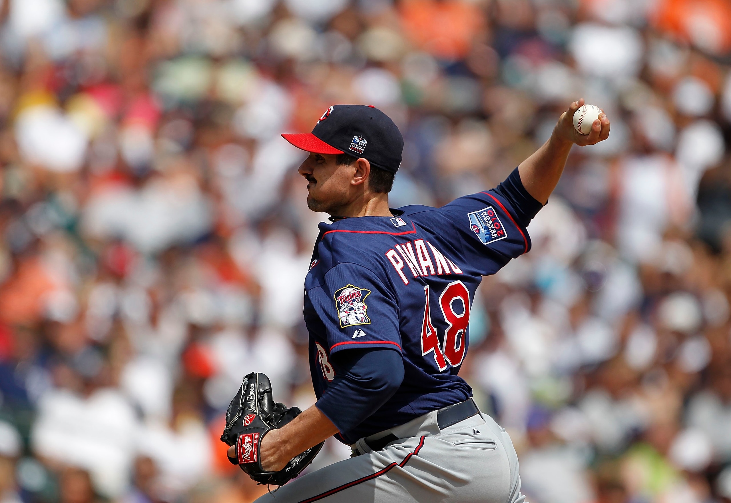 DETROIT - JULY 11:  Carl Pavano #48 of the Minnesota Twins pitches in the third inning during the game against the Detroit Tigers on July 11, 2010 at Comerica Park in Detroit, Michigan. The Twins defeated the Tigers 6-3. (Photo by Leon Halip/Getty Images)
