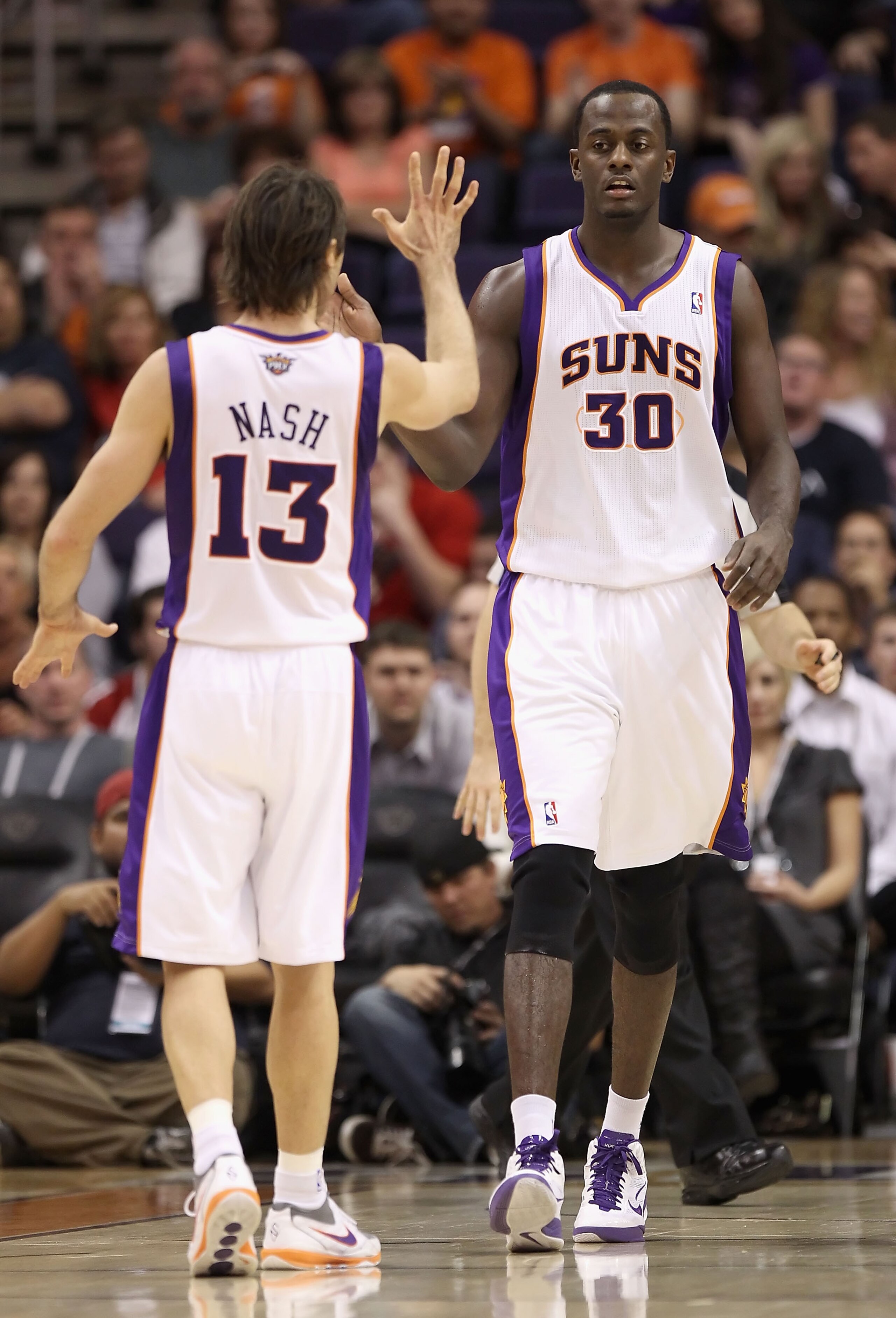 PHOENIX - DECEMBER 03: Earl Barron #30 of the Phoenix Suns high fives teammate Steve Nash #13 during the NBA game against the Indiana Pacers at US Airways Center on December 3, 2010 in Phoenix, Arizona. NOTE TO USER: User expressly acknowledges and agree PHOENIX - DECEMBER 03: Earl Barron #30 of the Phoenix Suns high fives teammate Steve Nash #13 during the NBA game against the Indiana Pacers at US Airways Center on December 3, 2010 in Phoenix, Arizona. NOTE TO USER: User expressly acknowledges and agree