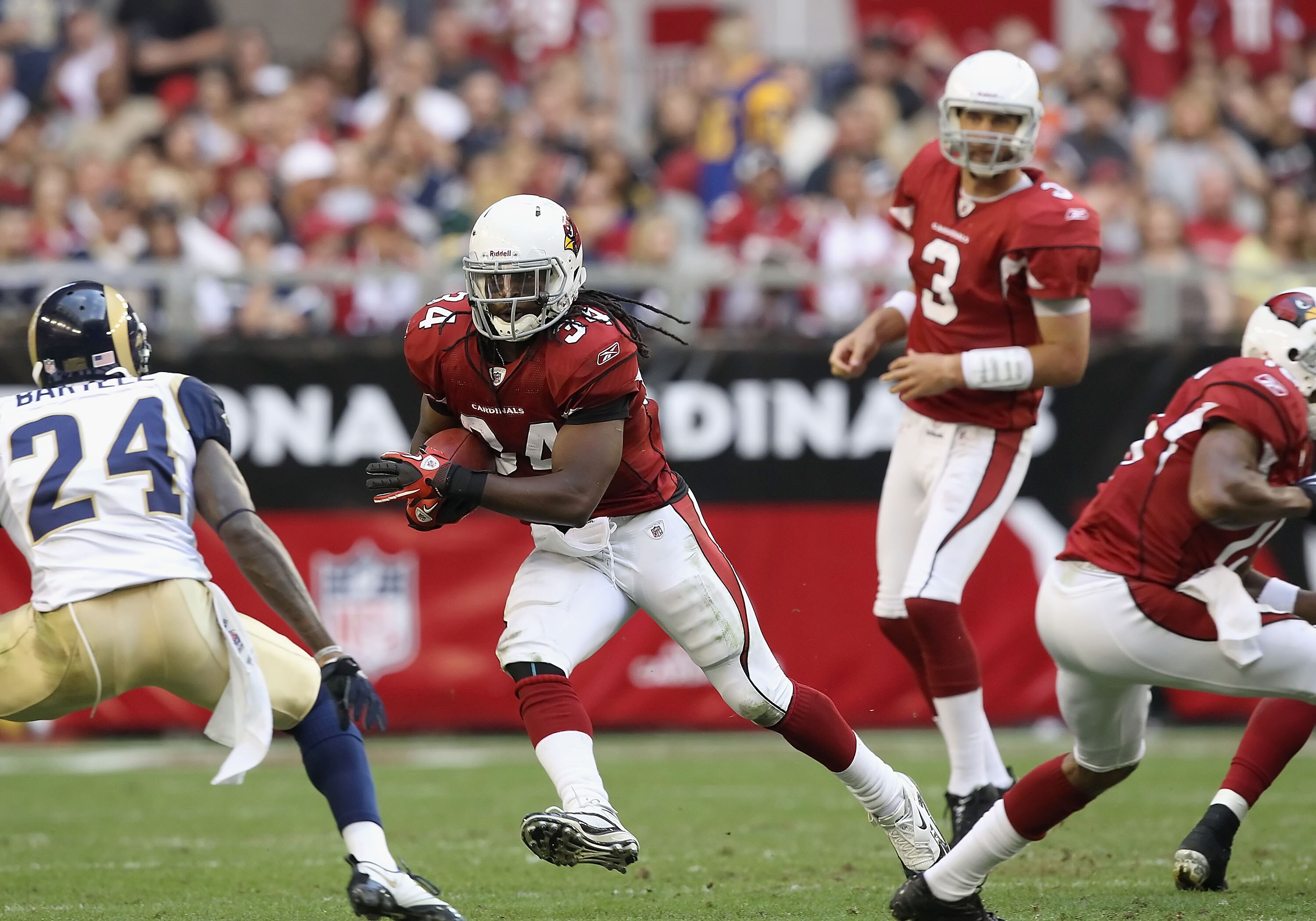 GLENDALE, AZ - DECEMBER 05:  Runningback Tim Hightower #34 of the Arizona Cardinals rushes the football against the St. Louis Rams during the NFL game at the University of Phoenix Stadium on December 5, 2010 in Glendale, Arizona.  The Rams defeated the Ca