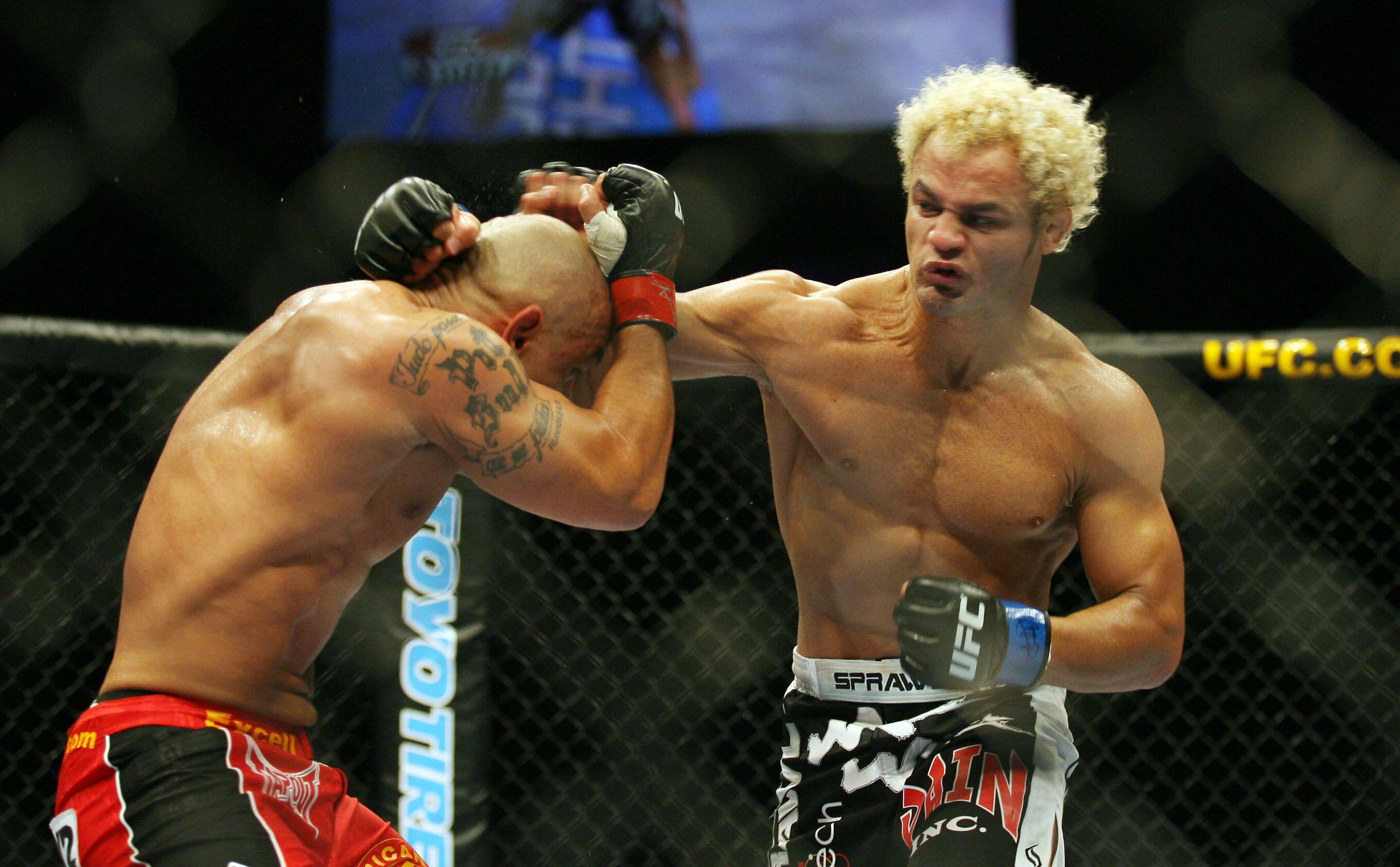 CHICAGO- OCTOBER 25: Josh Koscheck (R) punches Thiago Alves in a Welterweight bout  at UFC's Ultimate Fight Night at Allstate Arena on October 25, 2008 in Chicago, Illinois. (Photo by Tasos Katopodis/Getty Images)