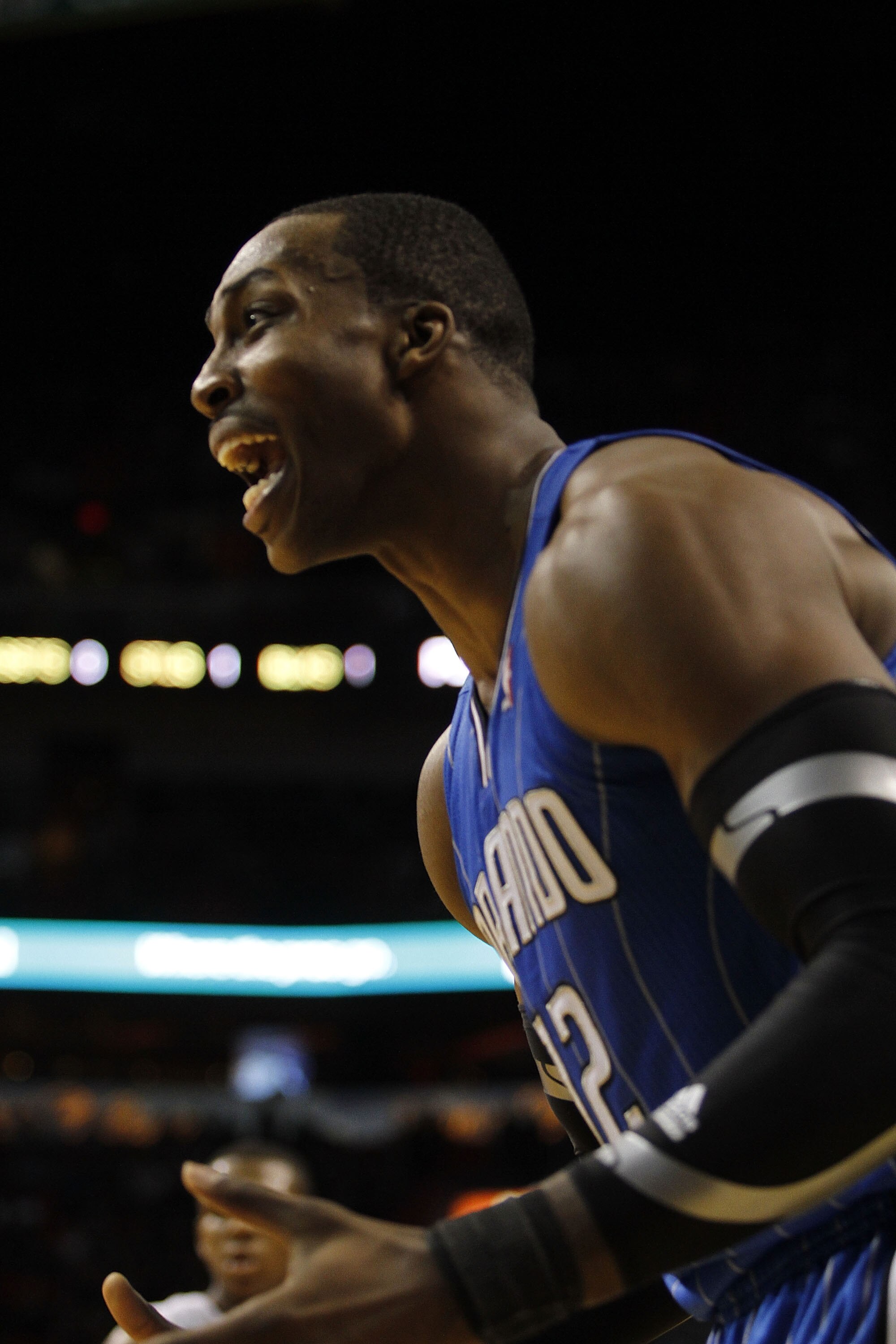 MIAMI - OCTOBER 29:  Center Dwight Howard #12  of the Orlando Magic reacts against the Miami Heat at American Airlines Arena on October 29, 2010 in Miami, Florida.  NOTE TO USER: User expressly acknowledges and agrees that, by downloading and or using thi