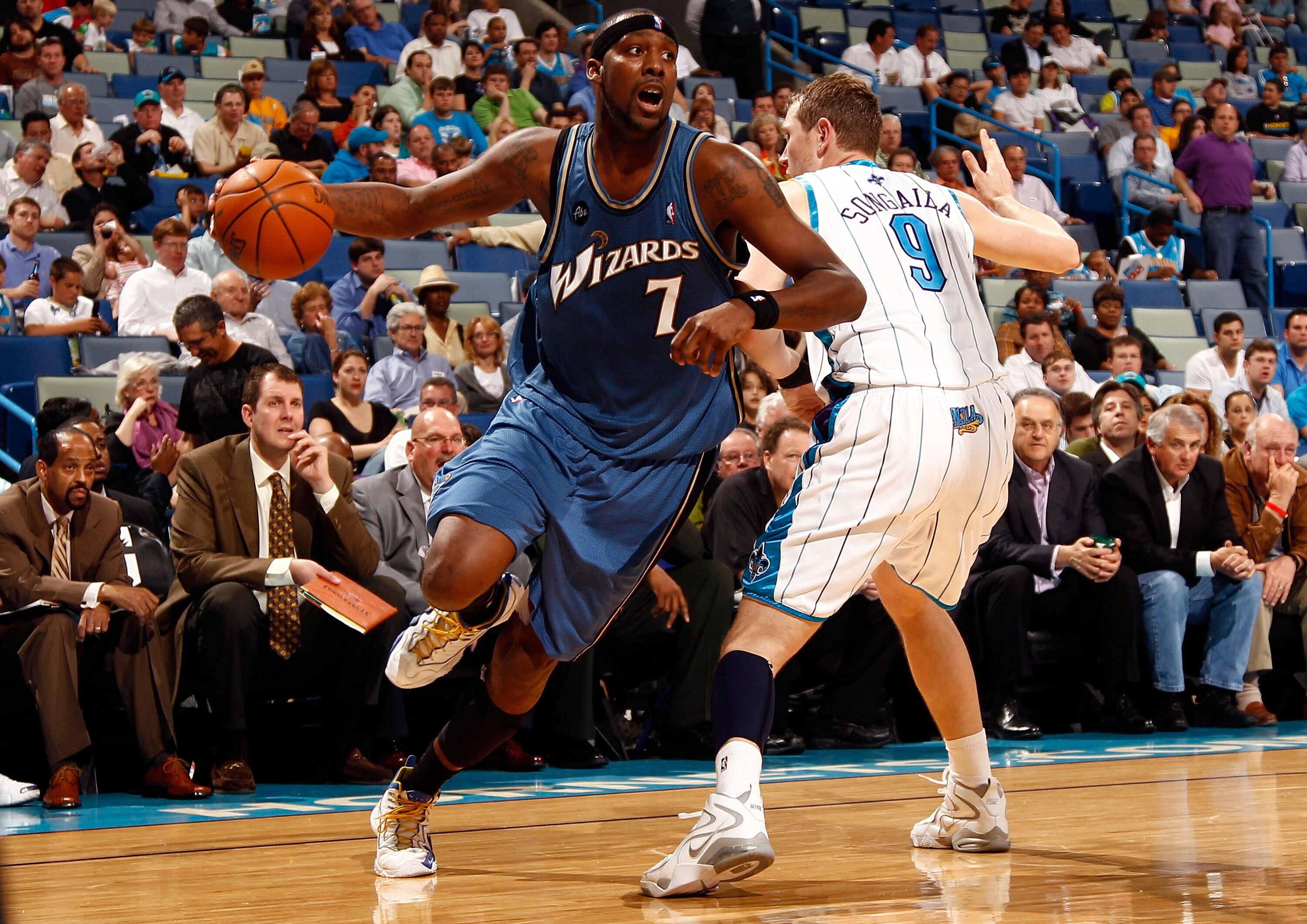 NEW ORLEANS - MARCH 31:  Andray Blatche #7 of the Washington Wizards drives the ball around Darius Songaila #9 of the New Orleans Hornets at New Orleans Arena on March 31, 2010 in New Orleans, Louisiana.  The Wizards defeated the Hornets 96-91.  NOTE TO U