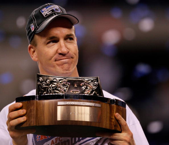 INDIANAPOLIS - JANUARY 24:  Quarterback Peyton Manning #18 of the Indianapolis Colts celebrates with the Lamar Hunt Trophy after defeating the New York Jets 30-17 during the AFC Championship Game at Lucas Oil Stadium on January 24, 2010 in Indianapolis, I