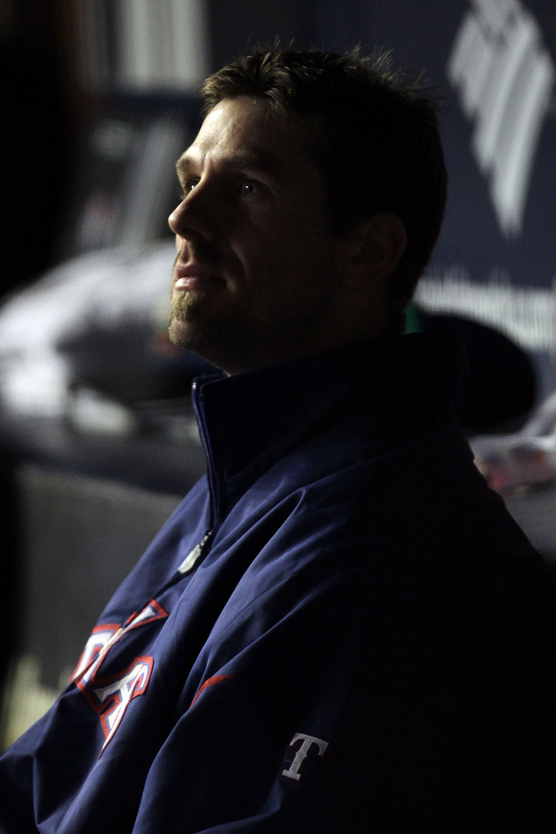 NEW YORK - OCTOBER 18:  Cliff Lee #33 of the Texas Rangers looks on in the dugout in the ninth inning against the New York Yankees  in Game Three of the ALCS during the 2010 MLB Playoffs at Yankee Stadium on October 18, 2010 in New York, New York. The Ran