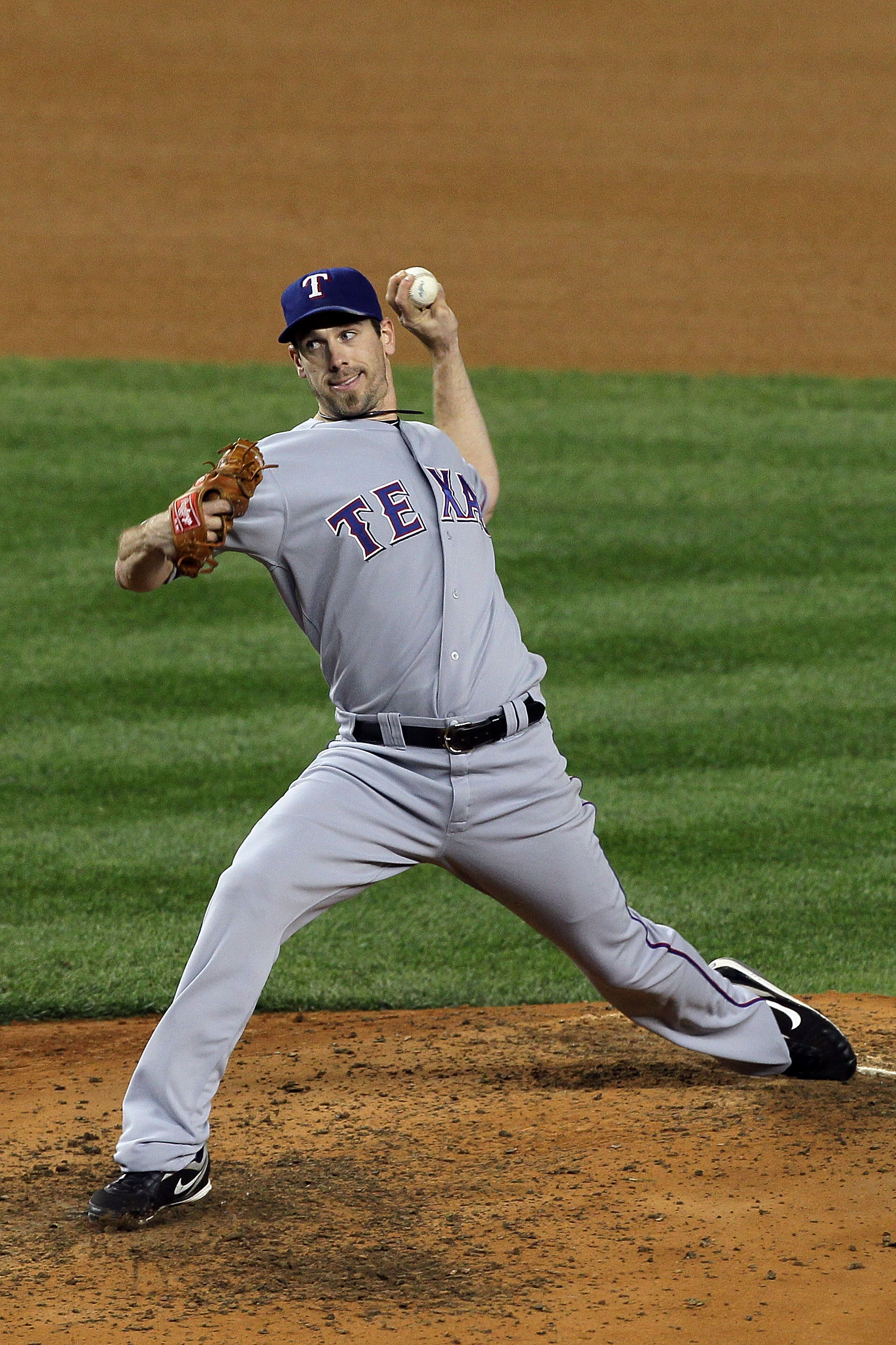 NEW YORK - OCTOBER 18:  Cliff Lee #33 of the Texas Rangers throws a pitch against the New York Yankees in Game Three of the ALCS during the 2010 MLB Playoffs at Yankee Stadium on October 18, 2010 in New York, New York. The Rangers won 8-0.  (Photo by Jim 