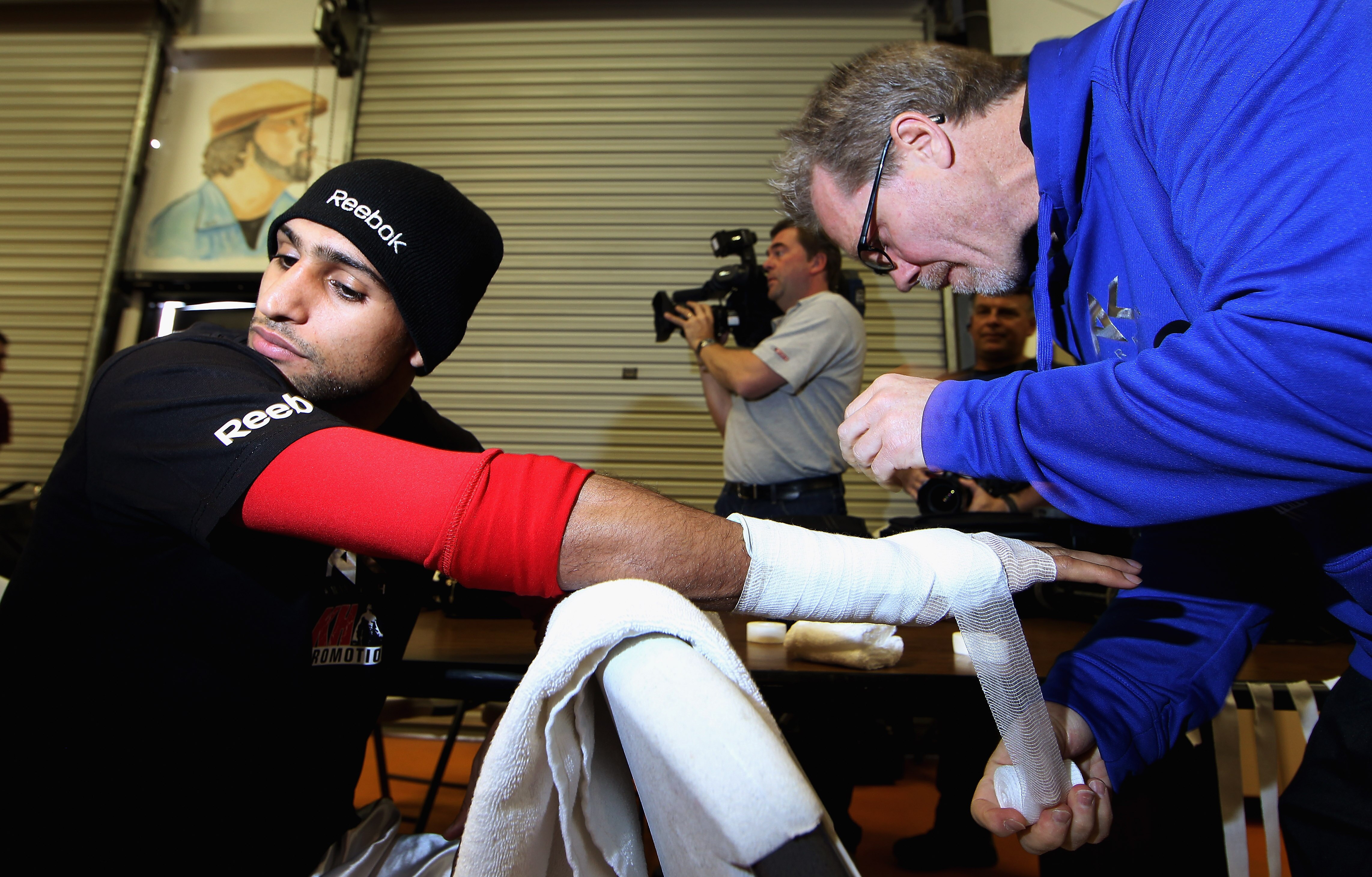 LAS VEGAS - DECEMBER 08:  Amir Khan has his hands prepared by his trainer Freddie Roach during his open workout at IBA gym on December 8, 2010 in Las Vegas, Nevada.  (Photo by Scott Heavey/Getty Images)