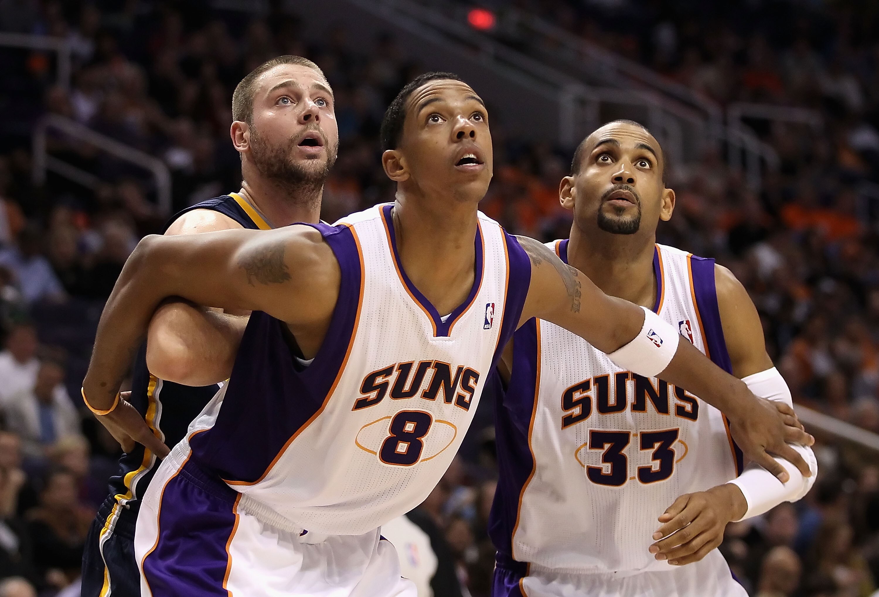PHOENIX - DECEMBER 03:  Josh McRoberts #32 of the Indiana Pacers is blocked out by Channing Frye #8 and Grant Hill #33 of the Phoenix Suns during the NBA game at US Airways Center on December 3, 2010 in Phoenix, Arizona.  The Suns defeated the Pacers 105-