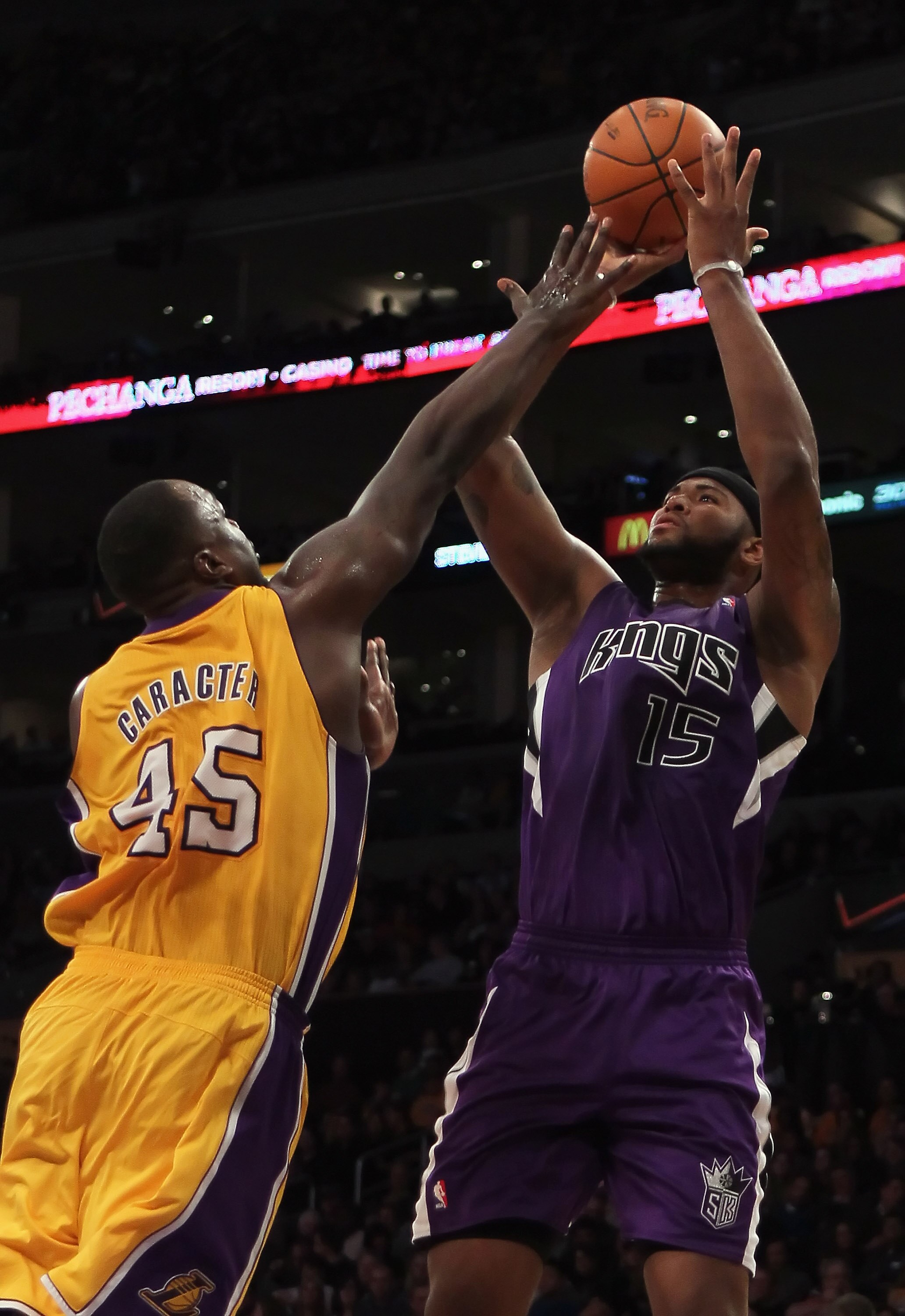 LOS ANGELES, CA - DECEMBER 03:  DeMarcus Cousins #15 of the Sacramento Kings shoots over Derrick Caracter #45 of the Los Angeles Lakers during the second half at Staples Center on December 3, 2010 in Los Angeles, California. The Lakers defeated the Kings