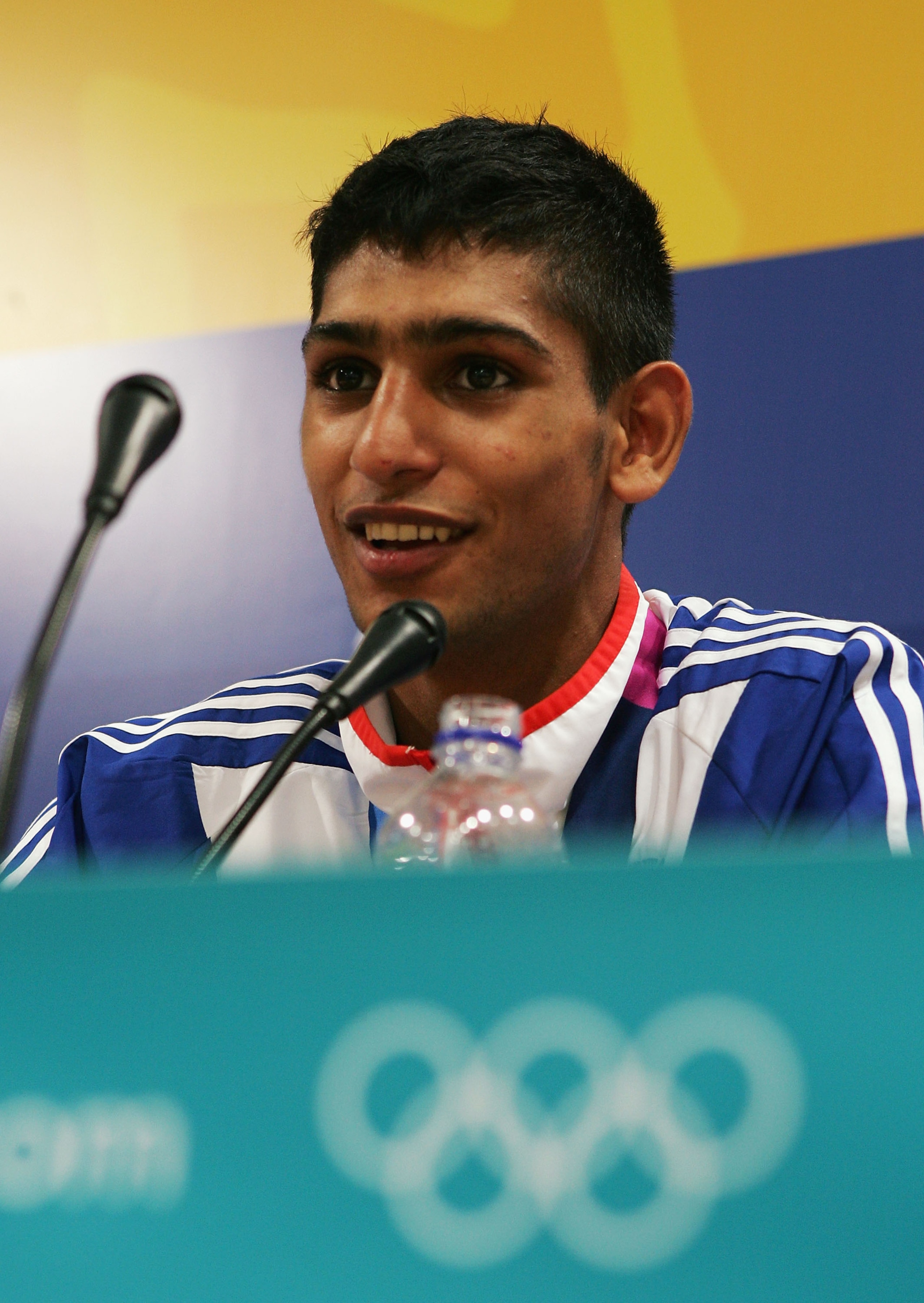 ATHENS - AUGUST 29:  Amir Khan of Great Britain speaks at a press conference after receiving his bronze medal for the men's boxing 60 kg event on August 29, 2004 during the Athens 2004 Summer Olympic Games at Peristeri Olympic Boxing Hall in Athens, Greec