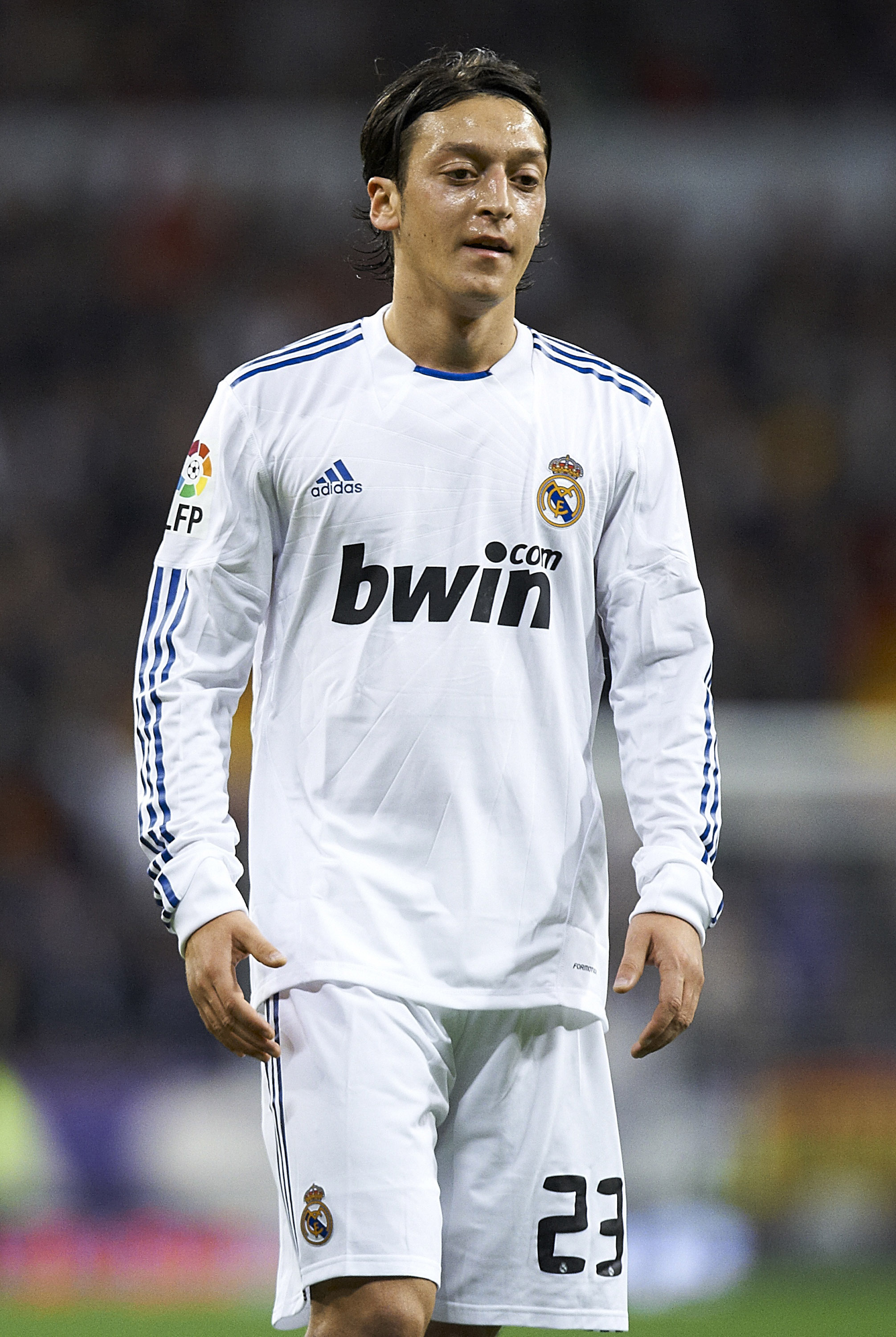 MADRID, SPAIN - NOVEMBER 20:  Mesut Ozil of Real Madrid looks on during the la liga match between Real Madrid and Athletic Bilbao at Estadio Santiago Bernabeu on November 20, 2010 in Madrid, Spain. Real Madrid won 5-1.  (Photo by Manuel Queimadelos Alonso