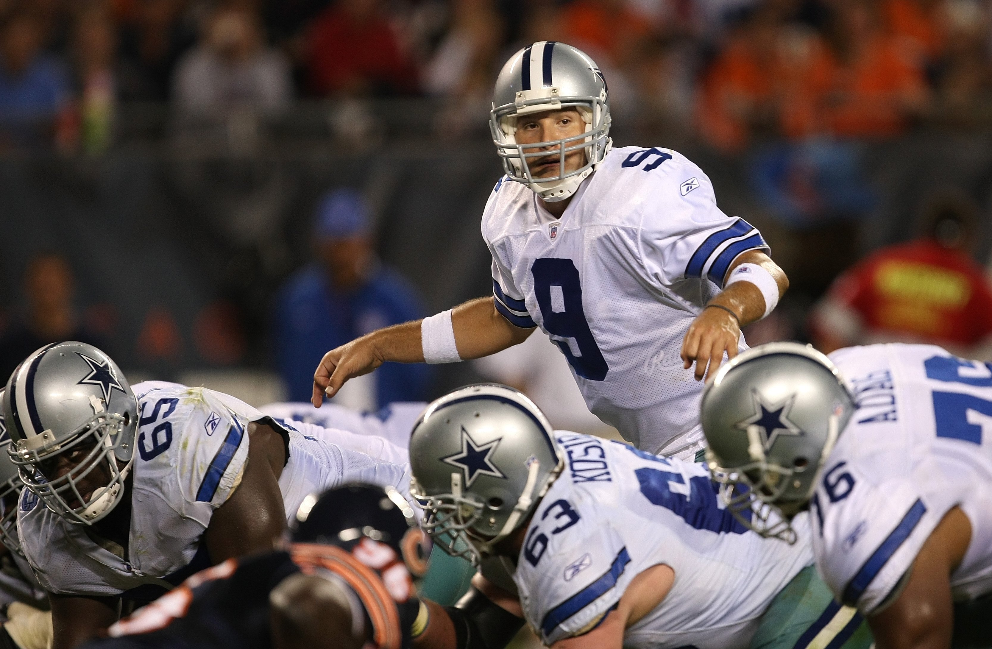 CHICAGO - SEPTEMBER 23:  Quarterback Tony Romo #9 of the Dallas Cowboys steps up to the line of scrimmage for an offensive play against the Chicago Bears at Soldier Field on September 23, 2007 in Chicago, Illinois. The Cowboys won 34-10. (Photo by Jonatha