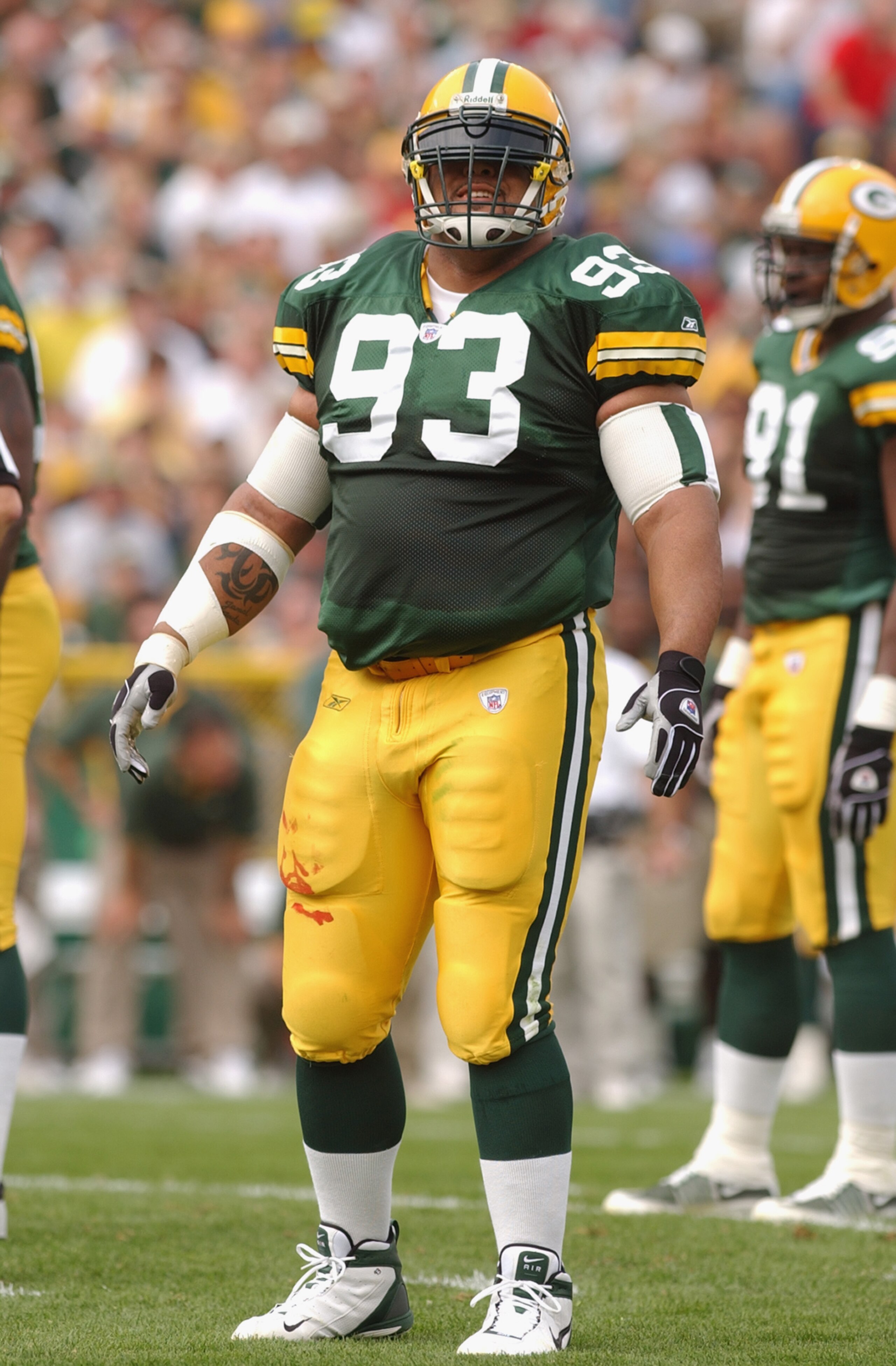GREEN BAY, WI - SEPTEMBER 29:  Defensive tackle Gilbert Brown #93 of the Green Bay Packers looks at the side line before the play against the Carolia Panthers on September 29, 2002 at Lambeau Field in Green Bay, Wisconsin. The Green Bay Packers defeated t