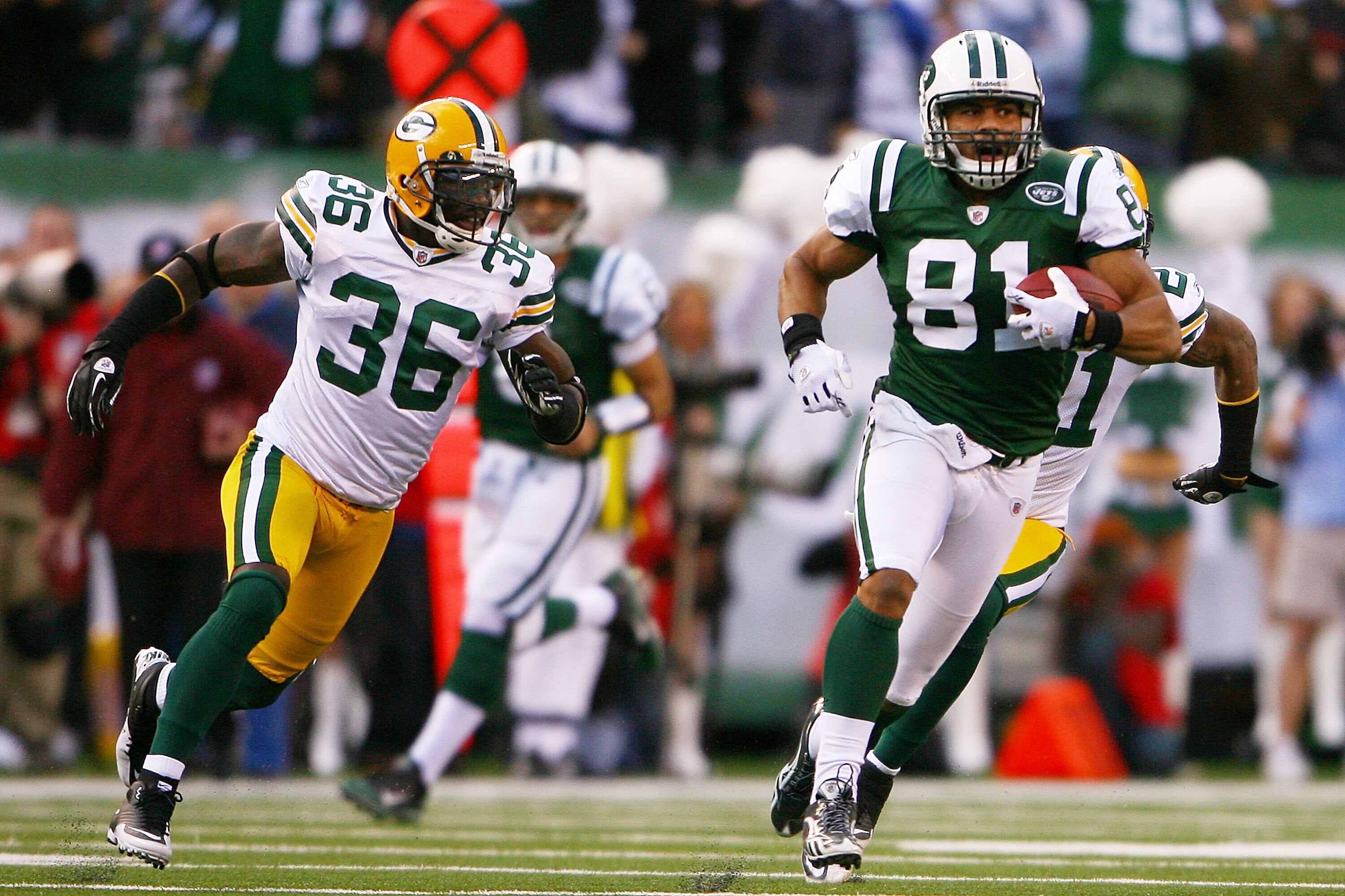 EAST RUTHERFORD, NJ - OCTOBER 31:  Dustin Keller #81 of the New York Jets runs with the ball while Nick Collins #36 of the Green Bay Packers chases him on October 31, 2010 at the New Meadowlands Stadium in East Rutherford, New Jersey. The Packers defeated
