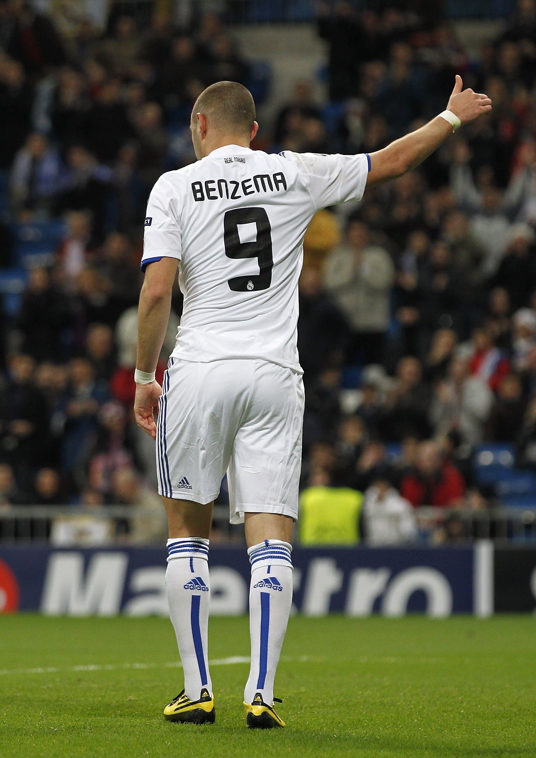 MADRID, SPAIN - DECEMBER 08:  Karim Benzema of Real Madrid celebrates after scoring Real's opening goal during the Champions League group G match between Real Madrid and AJ Auxerre at Estadio Santiago Bernabeu on December 8, 2010 in Madrid, Spain.  (Photo