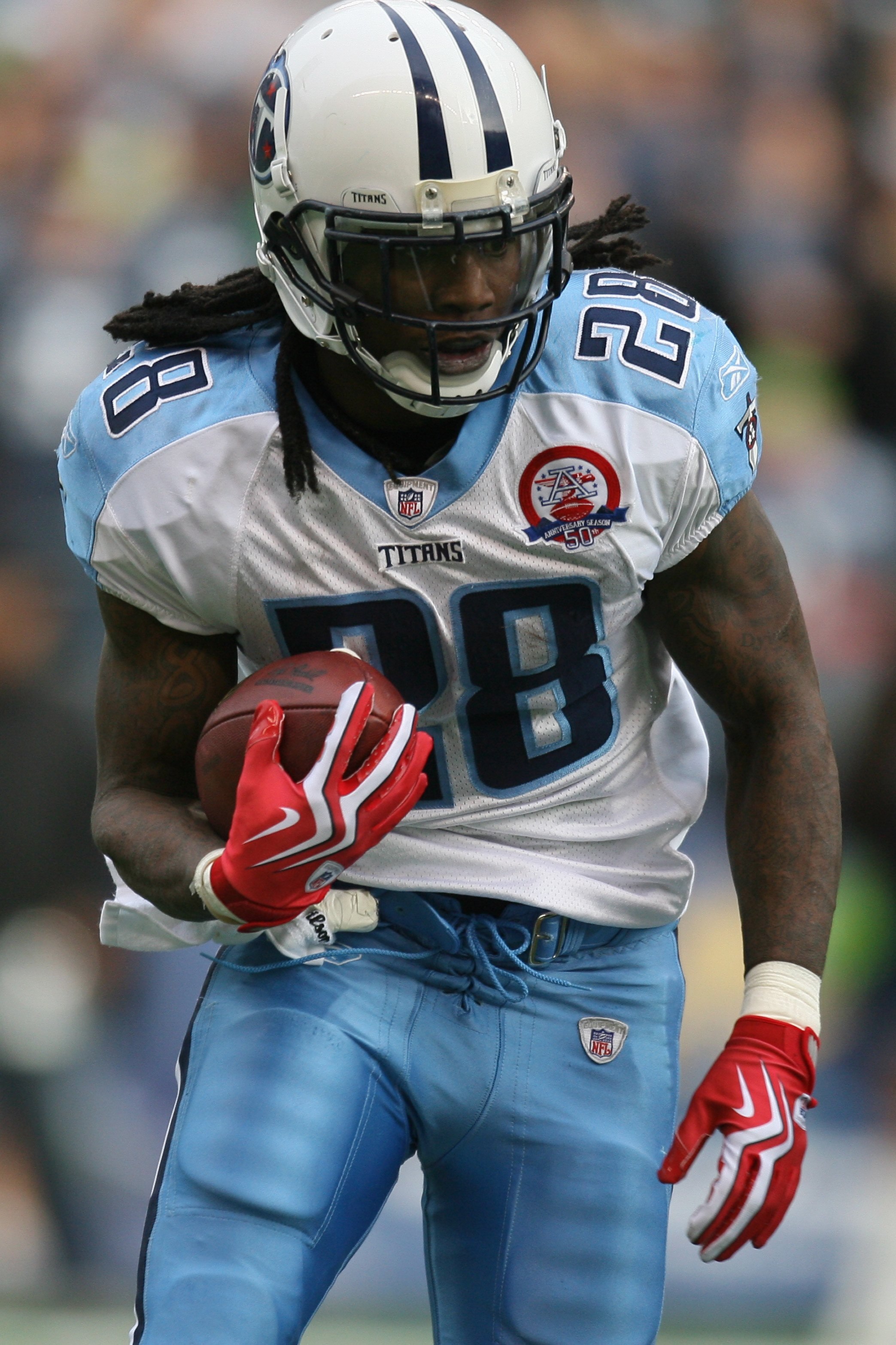 SEATTLE - JANUARY 03:  Chris Johnson #28 of the Tennessee Titans carries the ball during the game against the Seattle Seahawks on January 3, 2010 at Qwest Field in Seattle, Washington. (Photo by Otto Greule Jr/Getty Images)