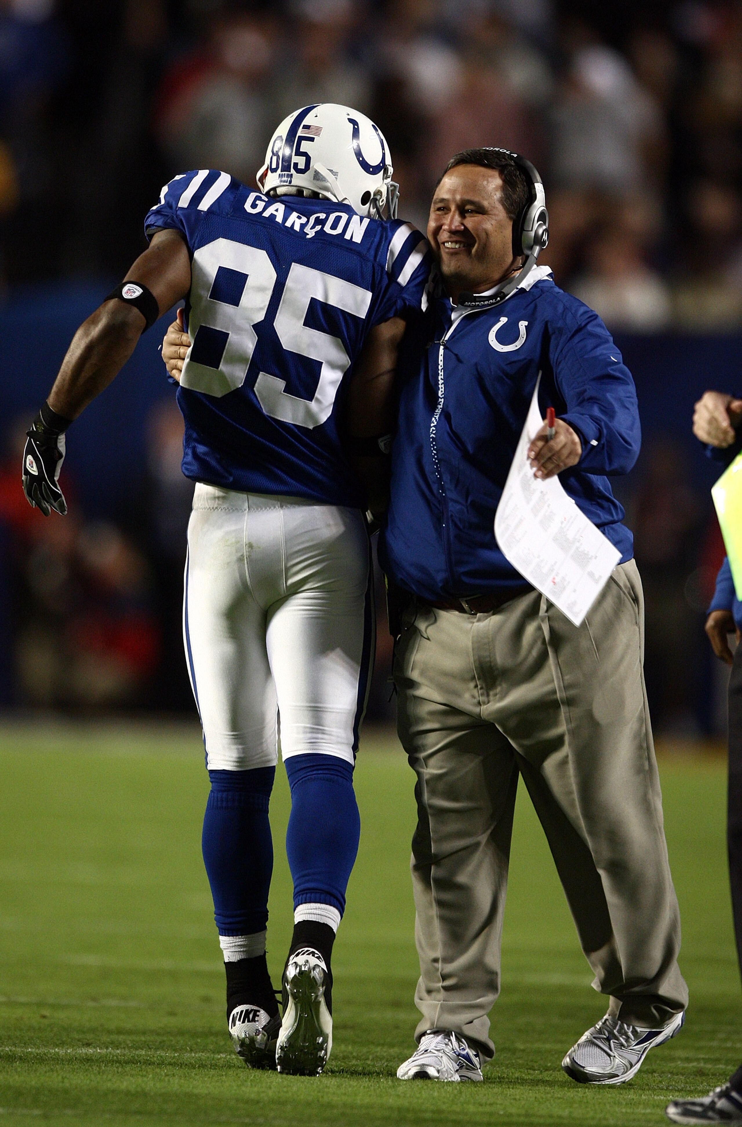 MIAMI GARDENS, FL - FEBRUARY 07: Pierre Garcon of the Indianapolis Colts celebrates on the sidelines with a coach against the New Orleans Saints during Super Bowl XLIV on February 7, 2010 at Sun Life Stadium in Miami Gardens, Florida.  (Photo by Donald Mi