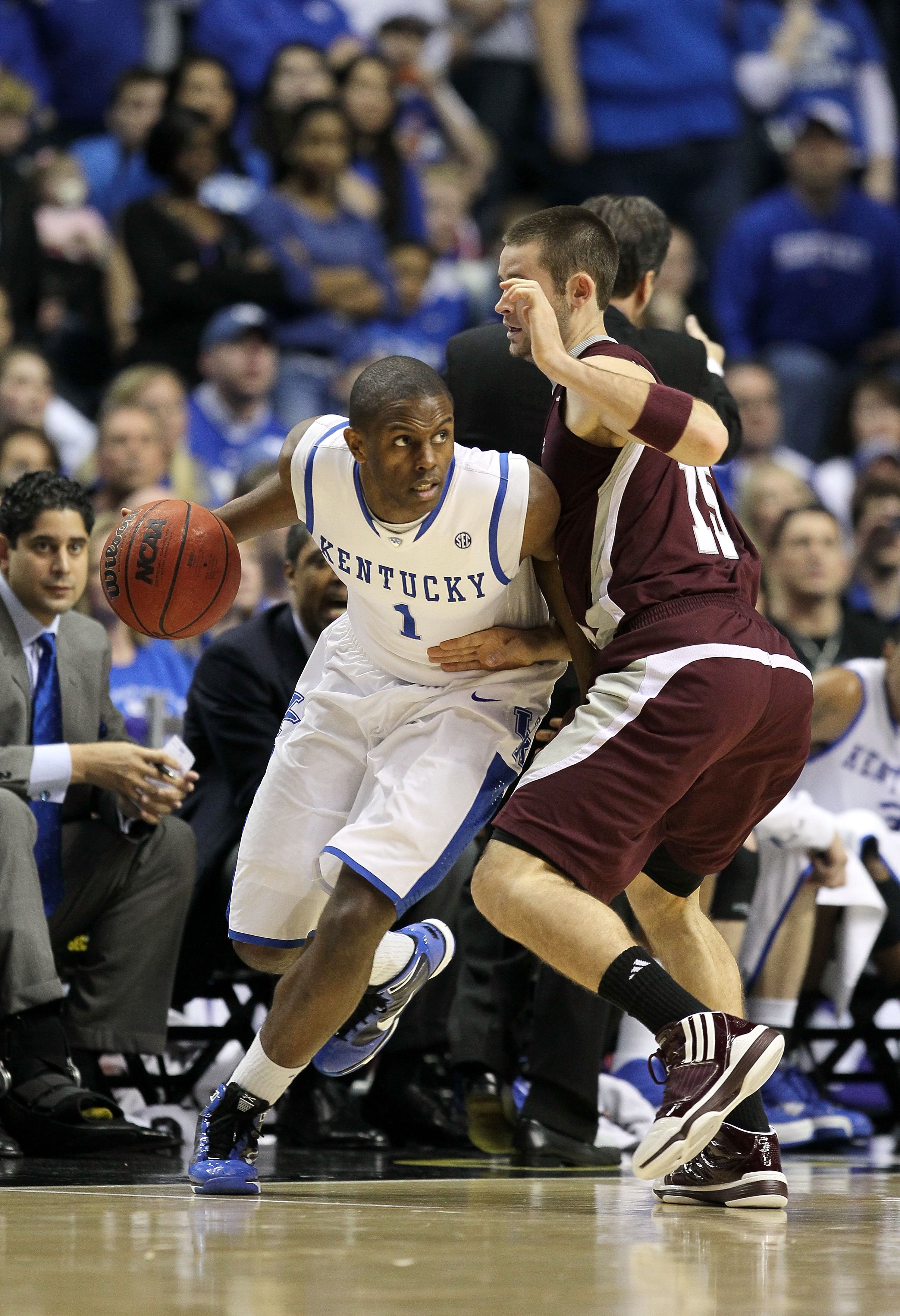 NASHVILLE, TN - MARCH 14:  Darius Miller #1 of the Kentucky Wildcats drives against Riley Benock #15 of the Mississippi State Bulldogs during the final of the SEC Men's Basketball Tournament at the Bridgestone Arena on March 14, 2010 in Nashville, Tenness
