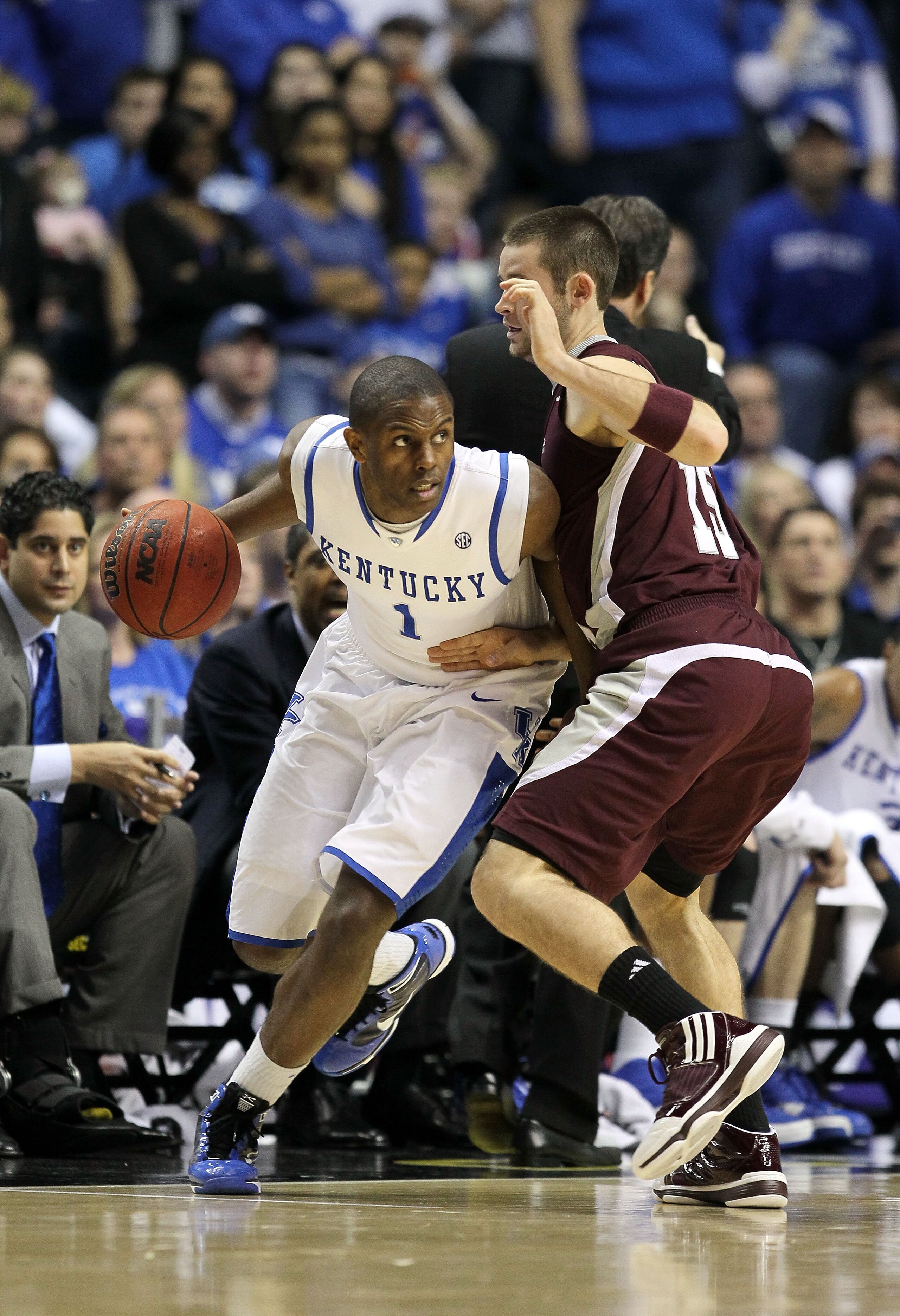 NASHVILLE, TN - MARCH 14:  Darius Miller #1 of the Kentucky Wildcats drives against Riley Benock #15 of the Mississippi State Bulldogs during the final of the SEC Men's Basketball Tournament at the Bridgestone Arena on March 14, 2010 in Nashville, Tenness