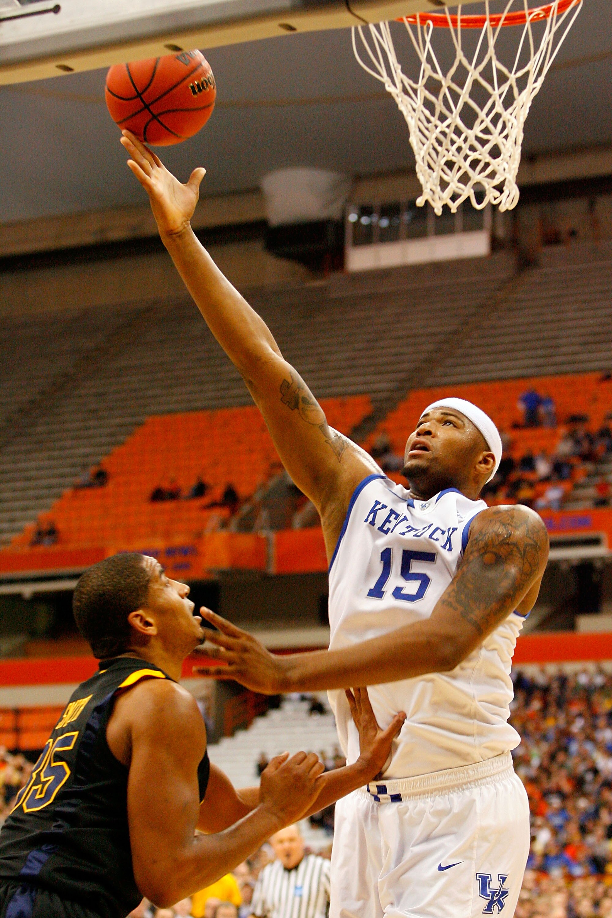 SYRACUSE, NY - MARCH 27:  DeMarcus Cousins #15 of the Kentucky Wildcats attempts a shot against Wellington Smith #35 of the West Virginia Mountaineers during the east regional final of the 2010 NCAA men's basketball tournament at the Carrier Dome on March