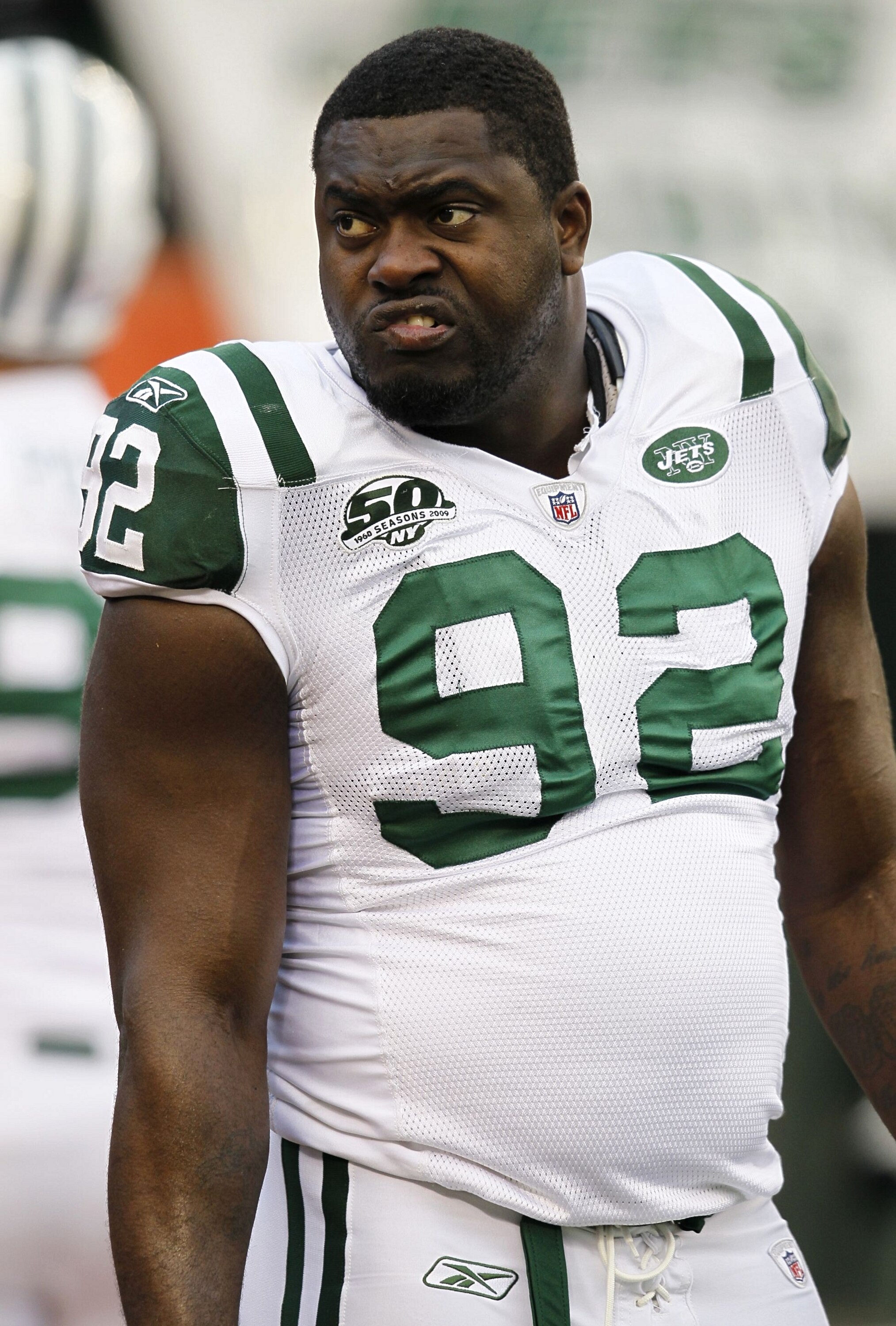 CINCINNATI - JANUARY 9:  Defensive end Shaun Ellis #92 of the New York Jets looks on before taking on the Cincinnati Bengals in the 2010 AFC wild-card playoff game at Paul Brown Stadium on January 9, 2010 in Cincinnati, Ohio. (Photo by Jonathan Daniel/Get