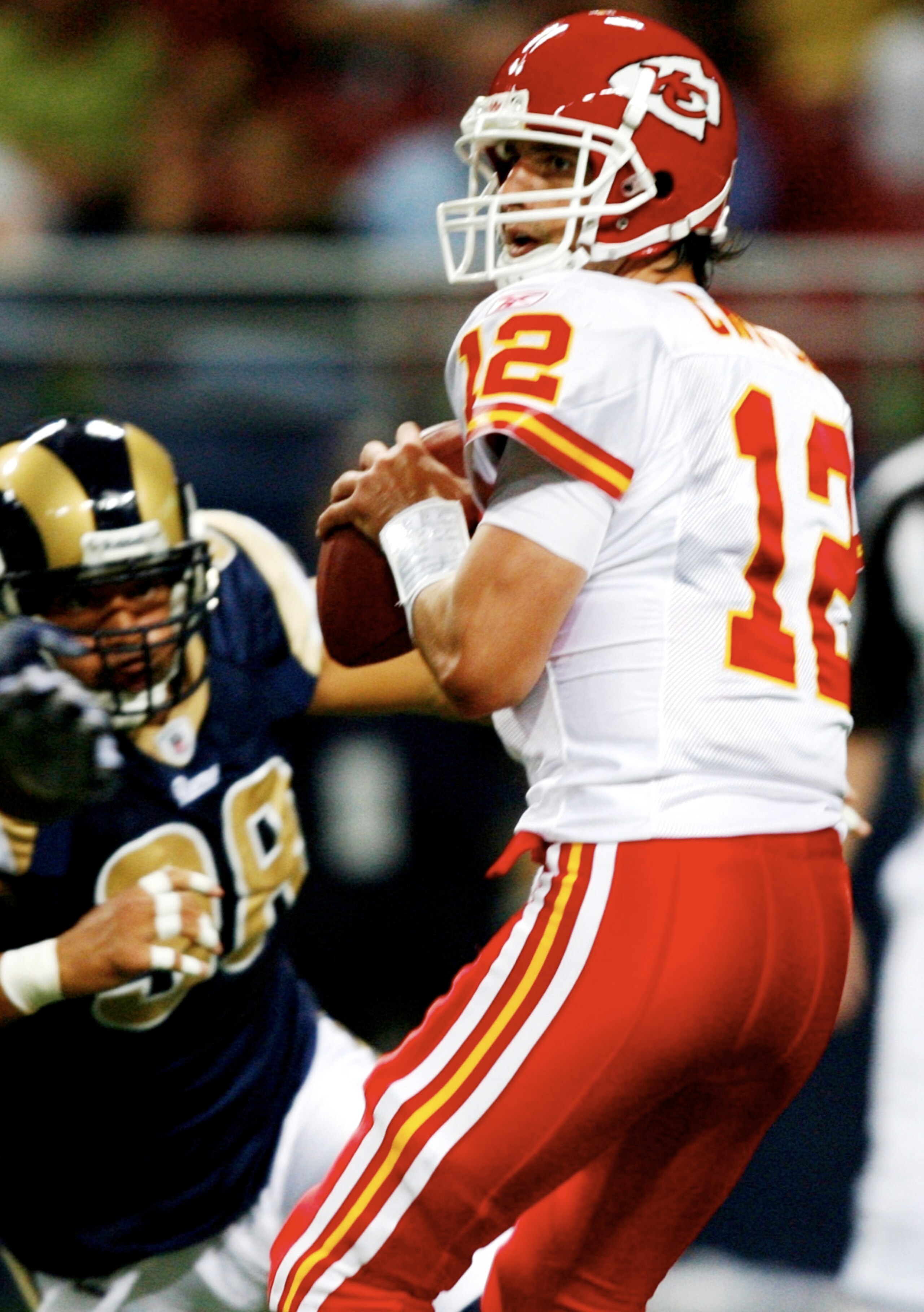 ST. LOUIS, MO - SEPTEMBER 03: Quarterback Brodie Croyle #12 of the Kansas City Chiefs drops back to pass against the defense of  C.J. Ah You  #98 of the St. Louis Rams during the preseason game at the Edward Jones Dome on September 3, 2009 in St. Louis, M