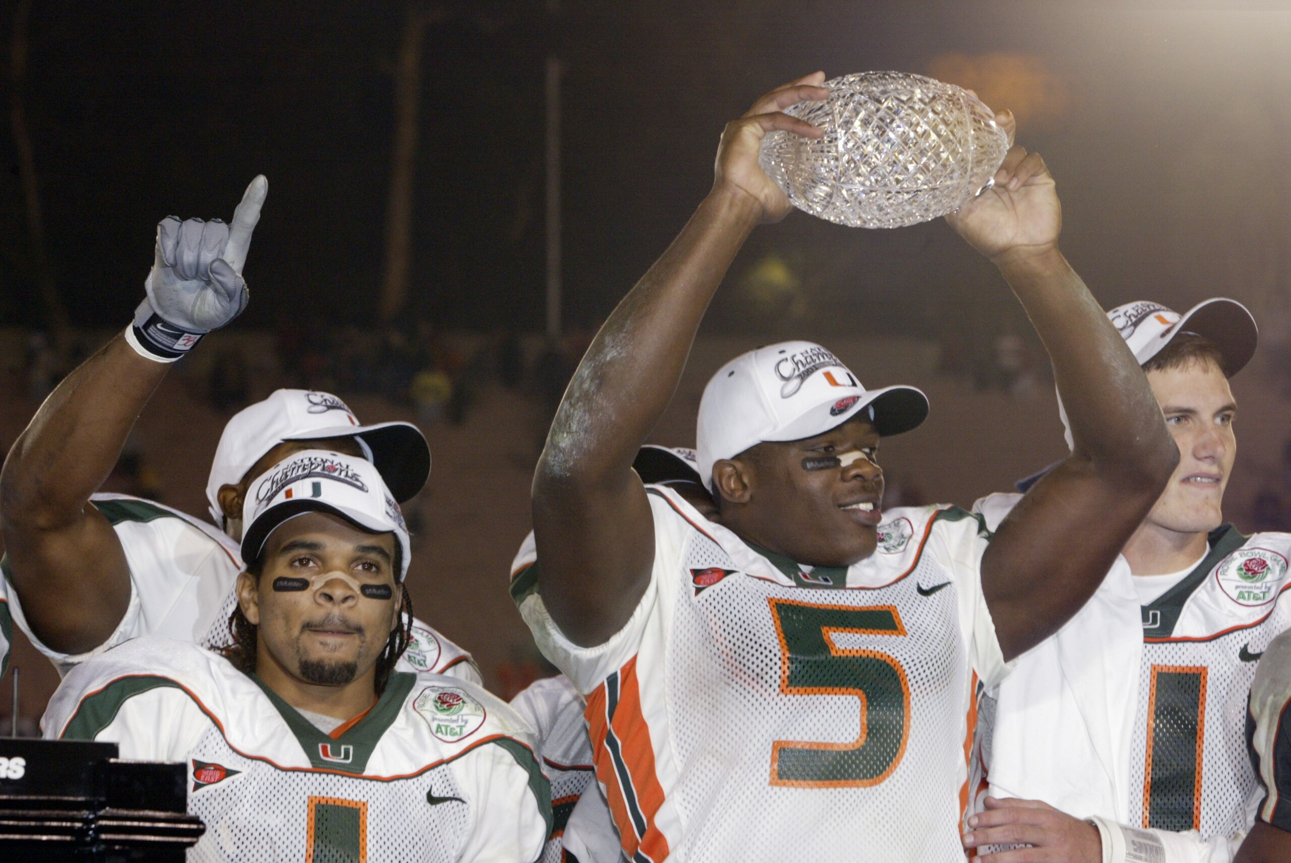 3 Jan 2002:  Andre Johnson #5 of Miami lifts the Sears National Championship trophy as teammates Ken Dorsey #11 and Daryl Jones # celebrate the win over Nebraska in the Rose Bowl National Championship game at the Rose Bowl in Pasadena, California.  Miami 