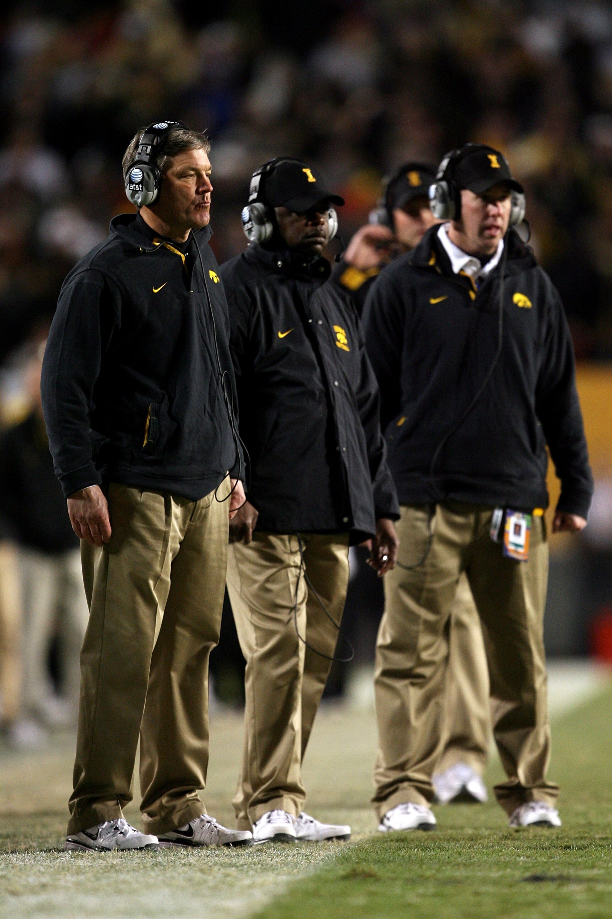 MIAMI GARDENS, FL - JANUARY 05:  Head coach Kirk Ferentz  (L) of the Iowa Hawkeyes looks on along with some of his assistant coaches against the Georgia Tech Yellow Jackets during the FedEx Orange Bowl at Land Shark Stadium on January 5, 2010 in Miami Gar
