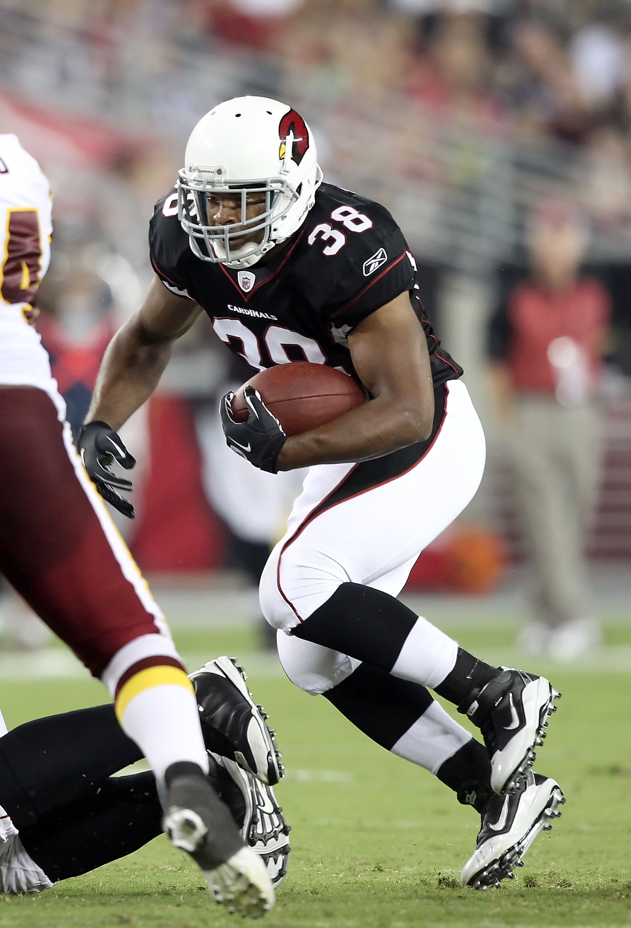 GLENDALE, AZ - SEPTEMBER 02:  Runningback Charles Scott #38 of the Arizona Cardinals rushes the football during preseason NFL game against the Washington Redskins at the University of Phoenix Stadium on September 2, 2010 in Glendale, Arizona. The Cardinal
