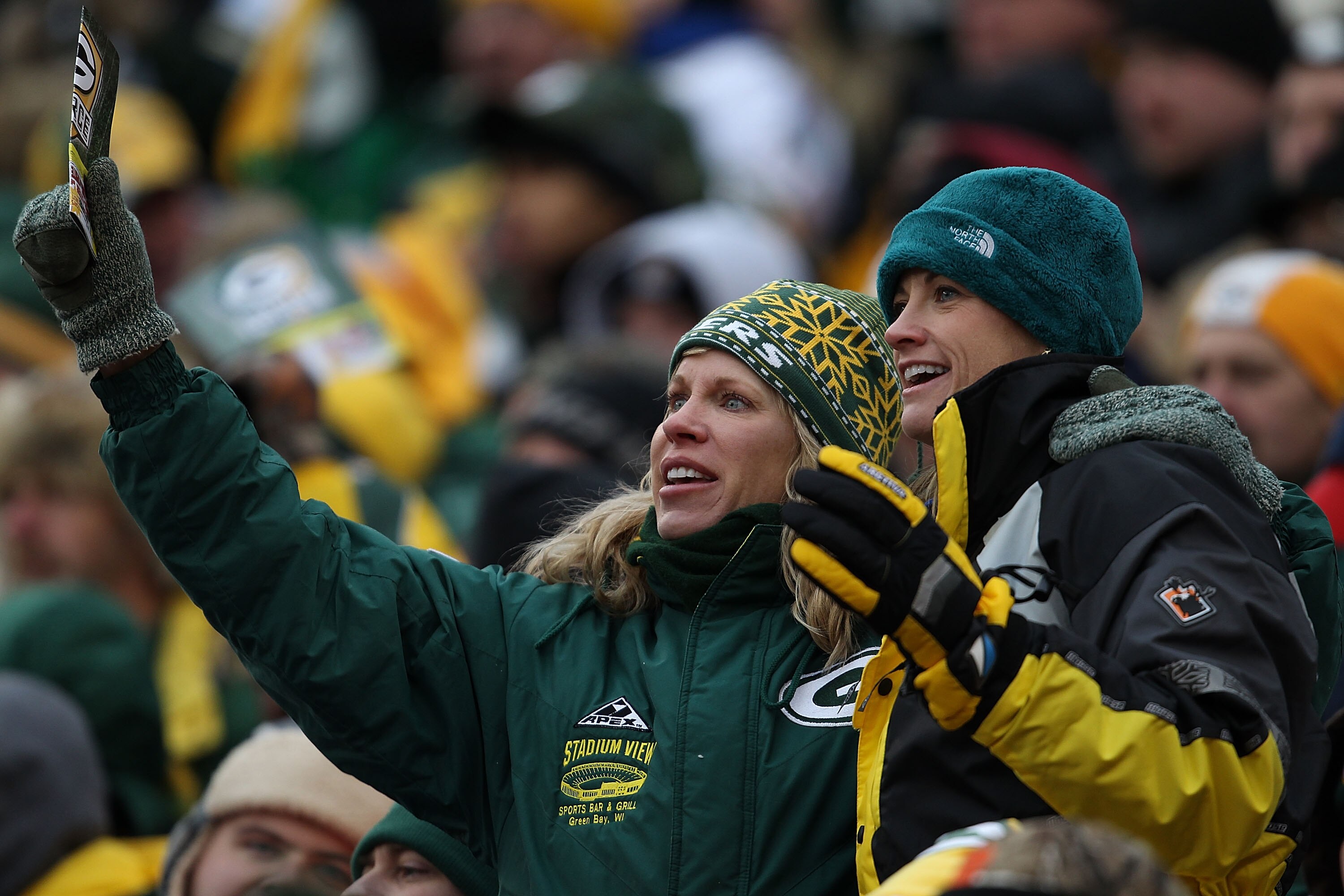 GREEN BAY, WI - DECEMBER 05: Fans of the Green Bay Packers cheer during a game against the San Francisco 49ers at Lambeau Field on December 5, 2010 in Green Bay, Wisconsin. The Packers defeated the 49ers 34-16. (Photo by Jonathan Daniel/Getty Images)
