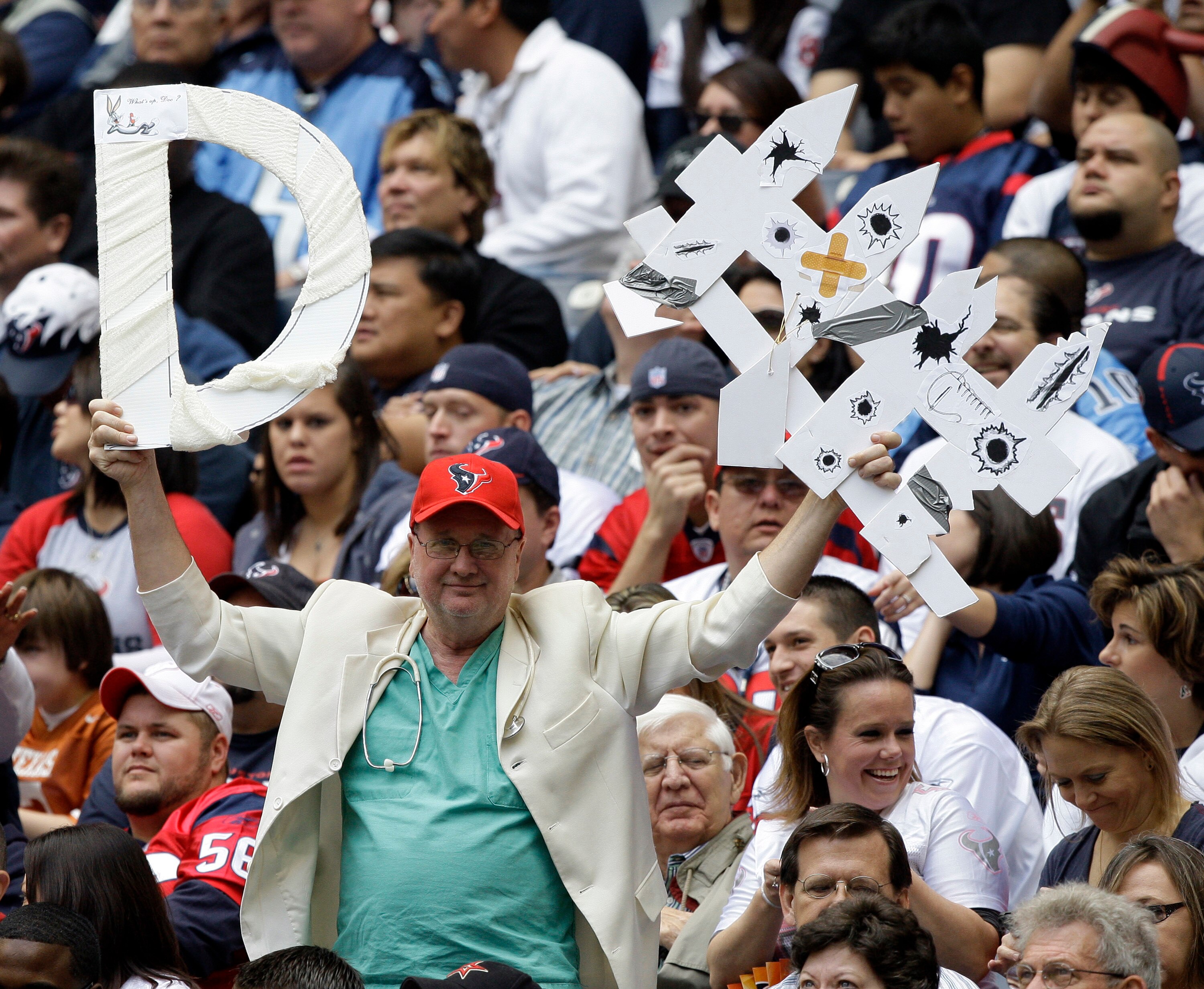 HOUSTON - NOVEMBER 28:  Houston Texans fans cheer on their defense againstd the Tennessee Titans at Reliant Stadium on November 28, 2010 in Houston, Texas.  (Photo by Bob Levey/Getty Images)