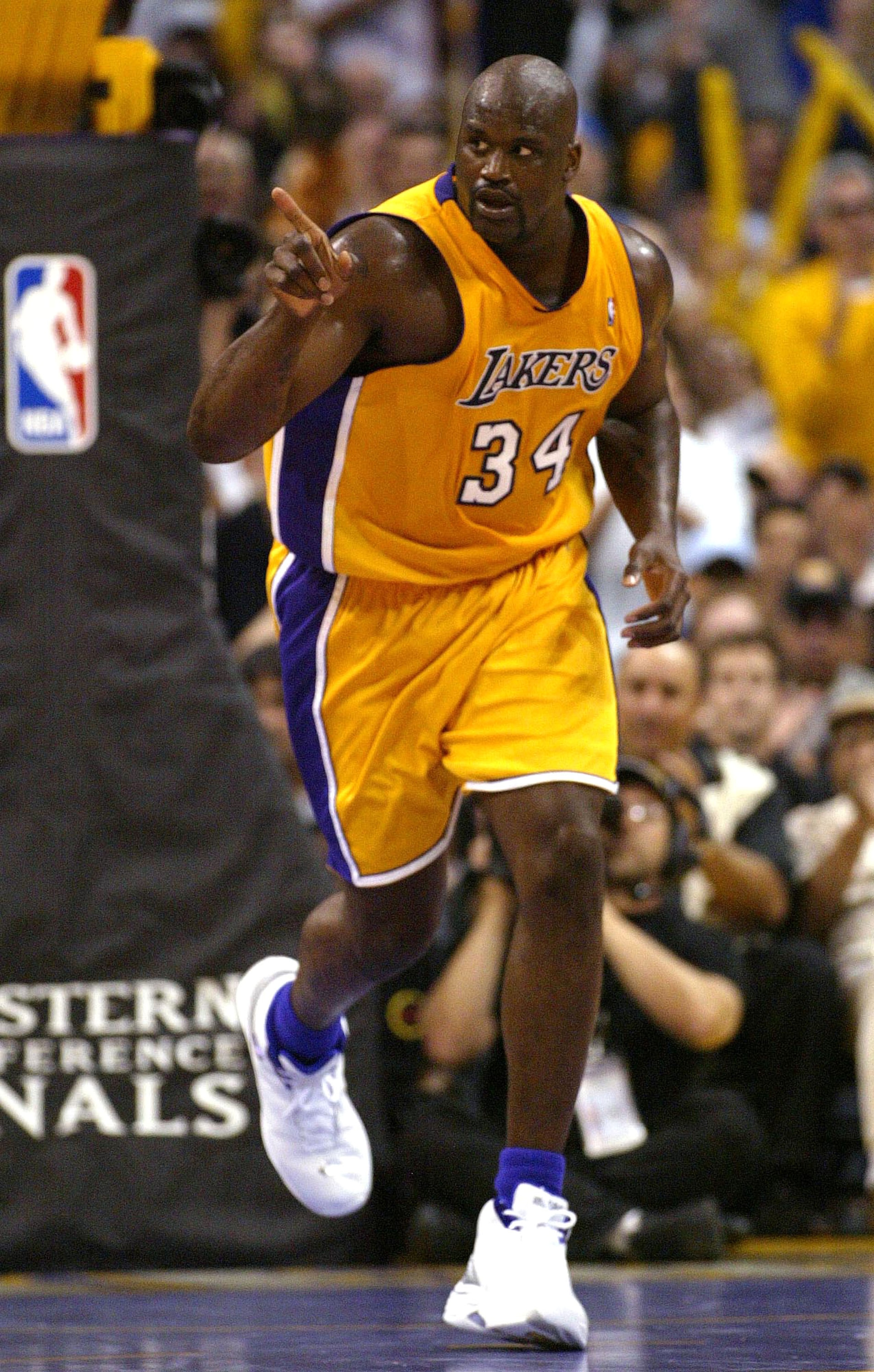 LOS ANGELES - MAY 31:  Shaquille O'Neal #34 of the Los Angeles Lakers gestures as he runs upcourt in the first half of Game 6 of the Western Conference Finals against the Minnesota Timberwolves during the 2004 NBA Playoffs on May 31, 2004 at Staples Cente