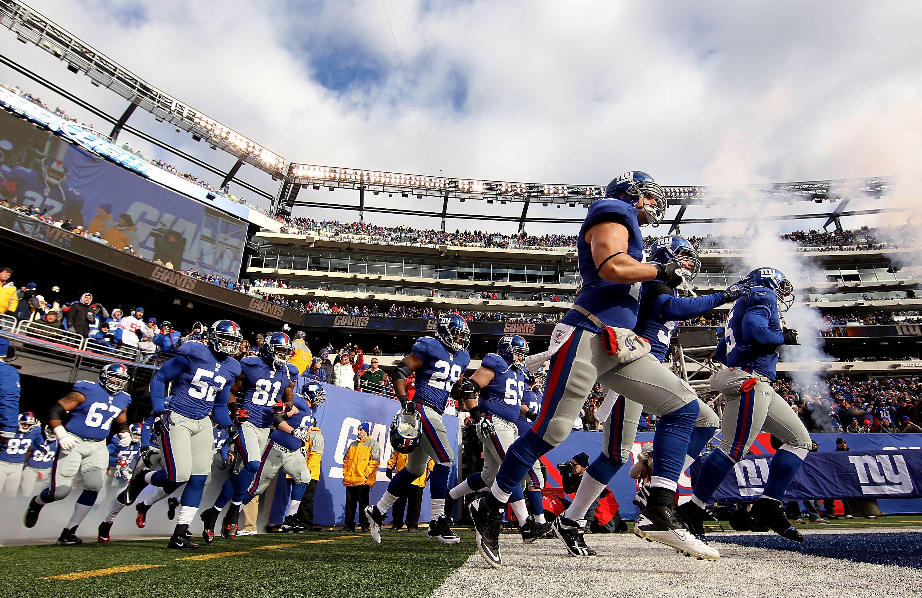 EAST RUTHERFORD, NJ - DECEMBER 05:  The New York Giants run onto the field before a game against the Washington Redskins on December 5, 2010 at The New Meadowlands Stadium in East Rutherford, New Jersey.  (Photo by Al Bello/Getty Images)