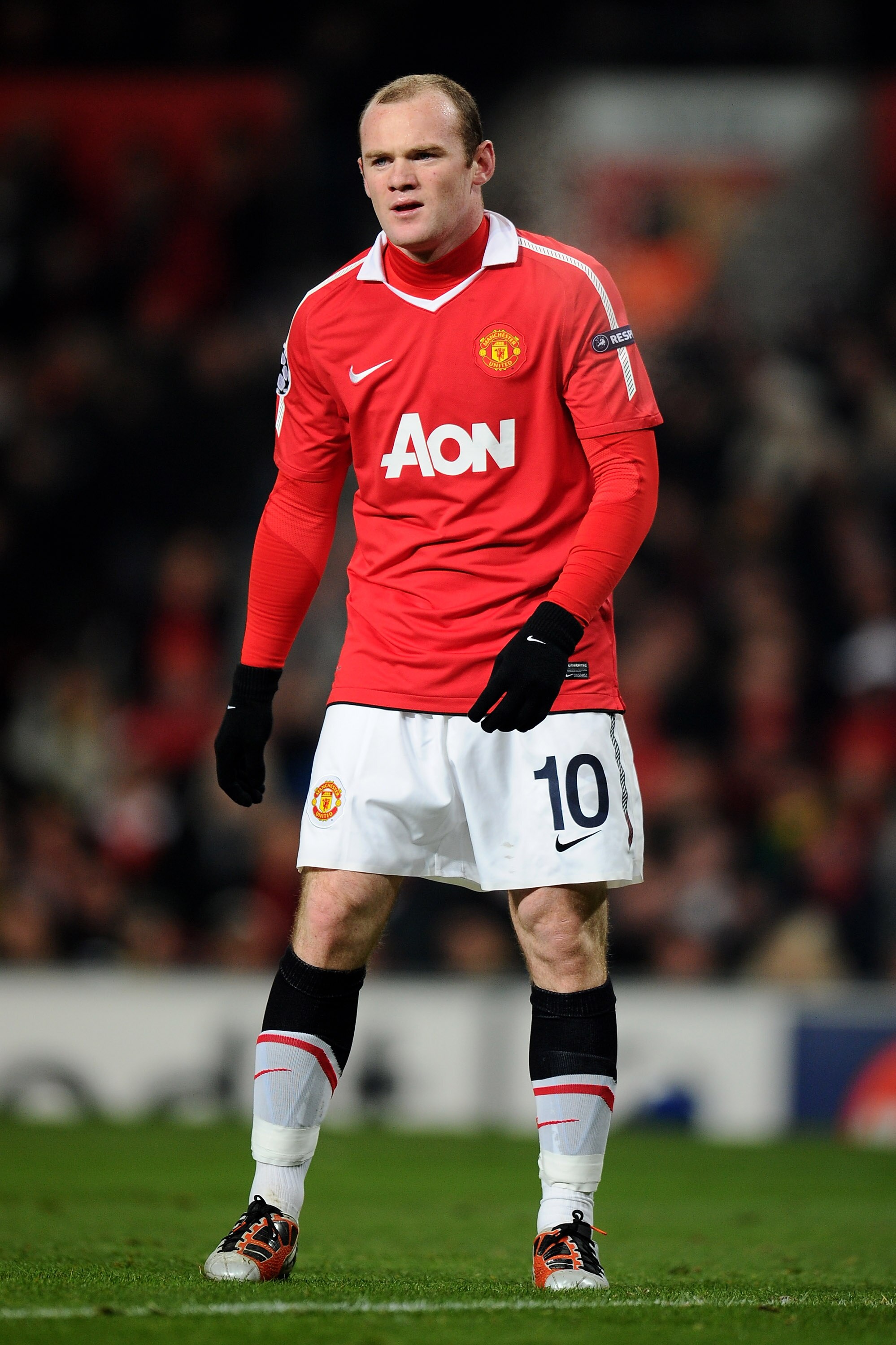 MANCHESTER, ENGLAND - DECEMBER 07:  Wayne Rooney of Manchester United looks on during the UEFA Champions League Group C match between Manchester United and Valencia at Old Trafford on December 7, 2010 in Manchester, England.  (Photo by Clive Mason/Getty I