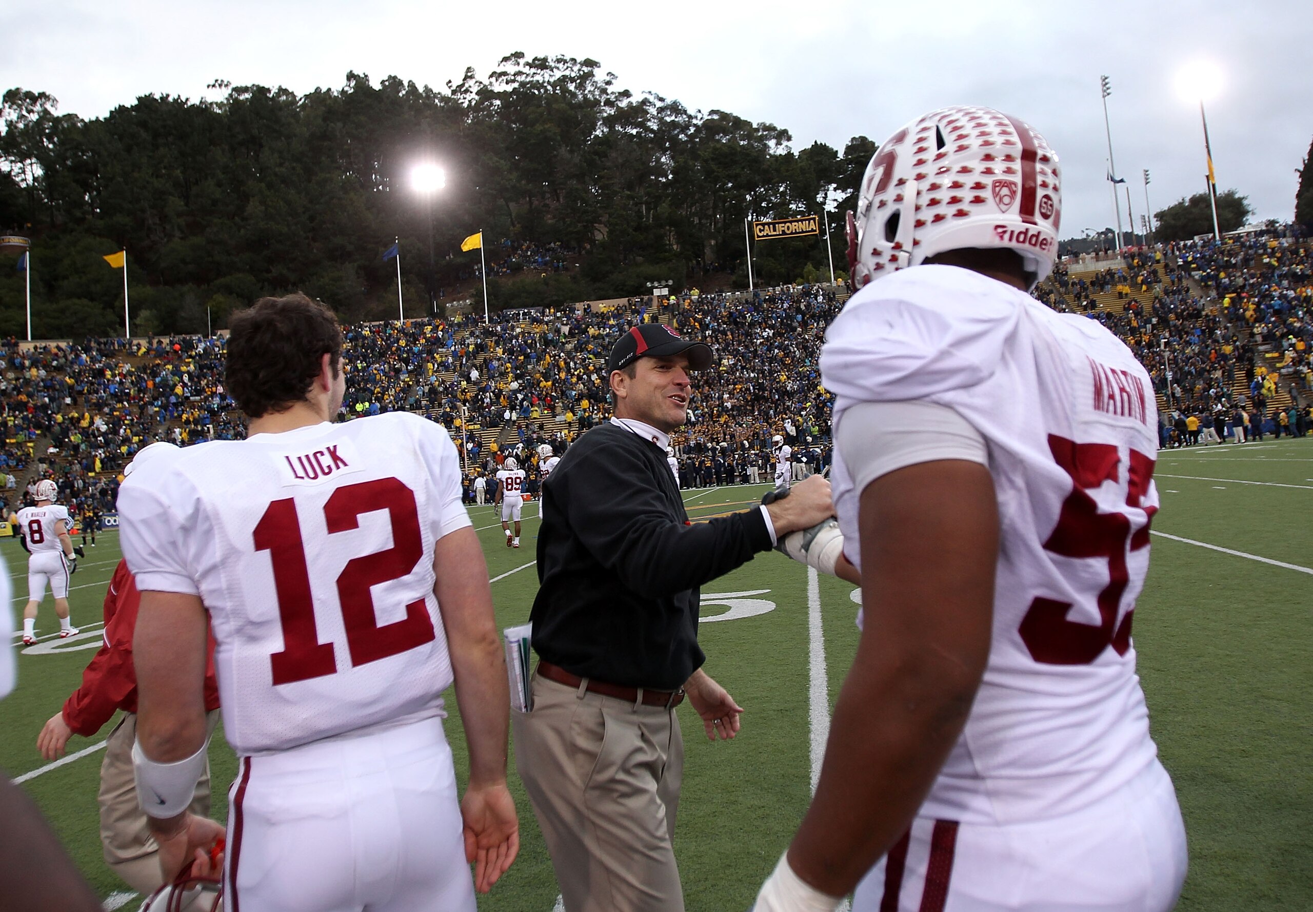 BERKELEY, CA - NOVEMBER 20:  Head coach Jim Harbaugh and Jonathan Martin #55 of the Stanford Cardinal shake hands after beating the California Golden Bears at California Memorial Stadium on November 20, 2010 in Berkeley, California.  (Photo by Ezra Shaw/G