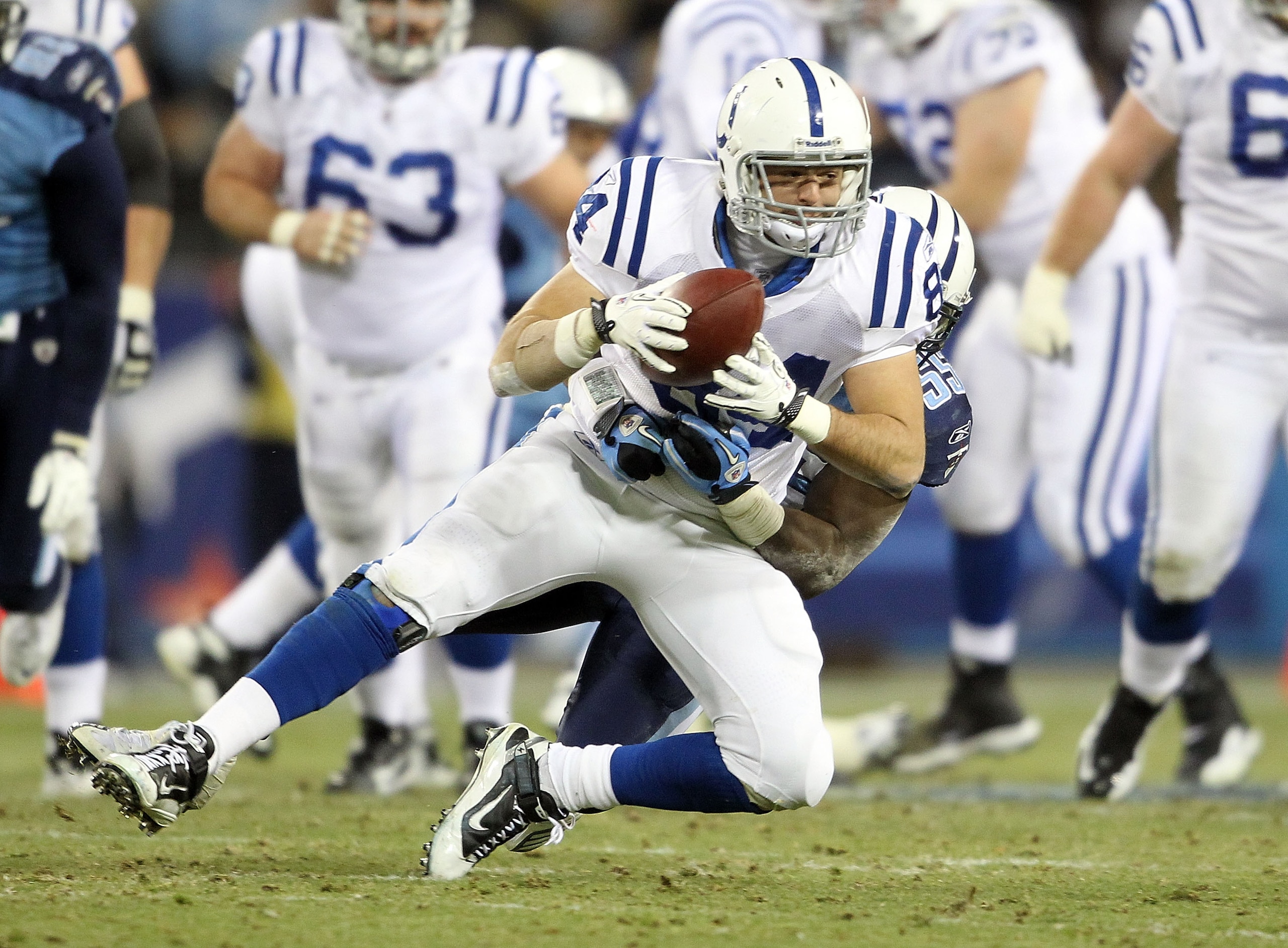 NASHVILLE, TN - DECEMBER 09:  Jacob Tamme #84 of the Indianapolis Colts runs with the ball after a reception while defended by Stephen Tulloch #55  of the Tennessee Titans during the NFL game at LP Field on December 9, 2010 in Nashville, Tennessee.  (Phot