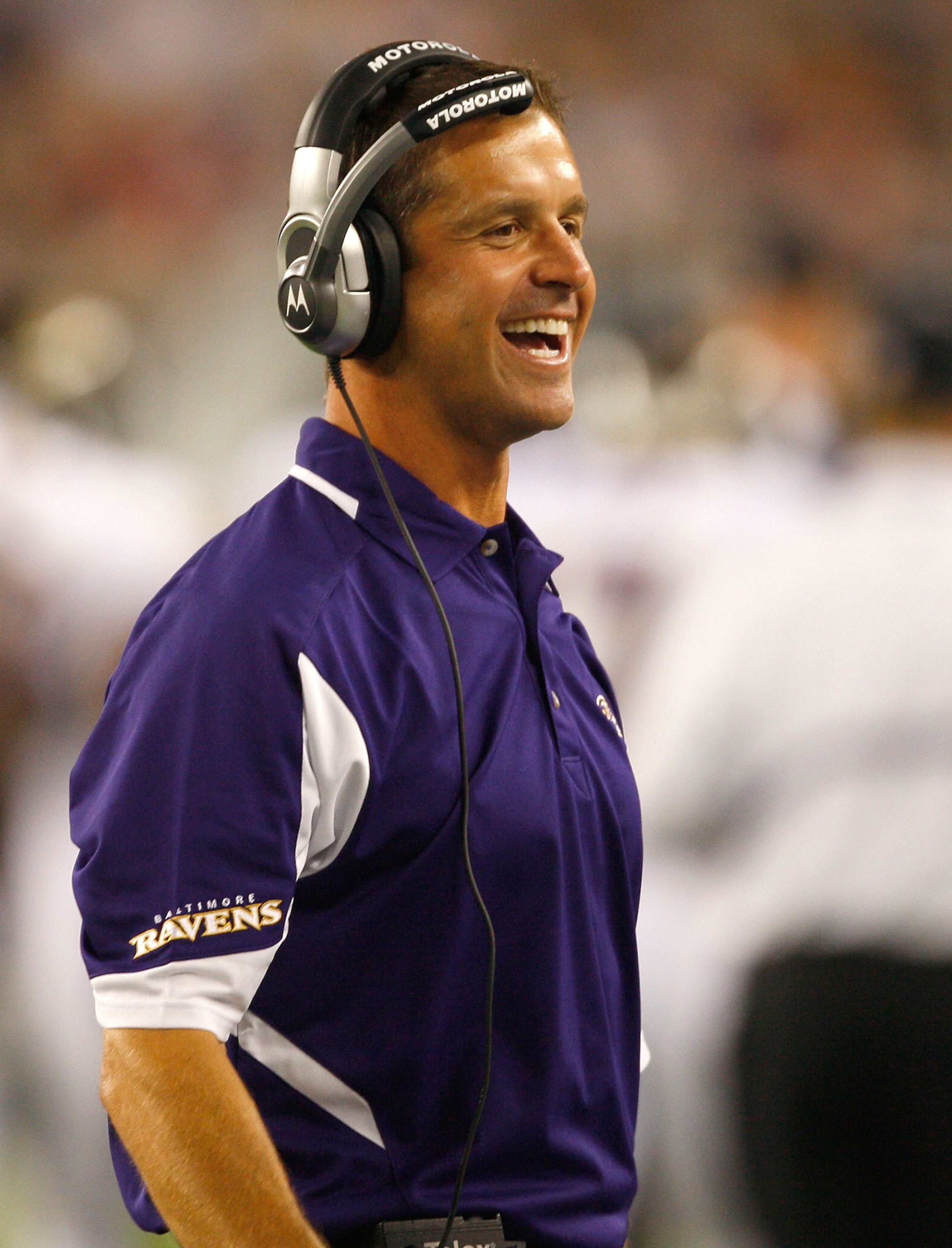 FOXBORO, MA - AUGUST 7: Coach John Harbaugh of the Baltimore Ravens smiles after a touchdown against the New England Patriots during a preseason game at Gillette Stadium on August 7, 2008 in Foxboro, Massachusetts. (Photo by Jim Rogash/Getty Images)