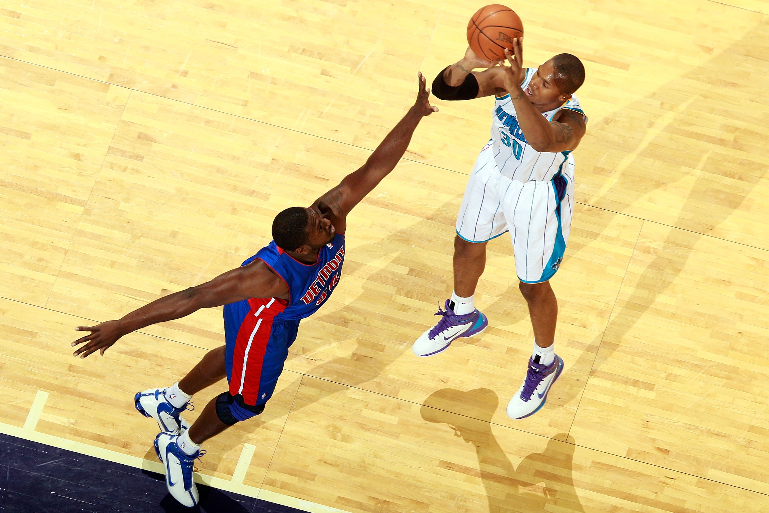 NEW ORLEANS, LA - DECEMBER 08: David West #30 of the New Orleans Hornets shoots the ball over Jason Maxiell #54 of the Detroit Pistons at the New Orleans Arena on December 8, 2010 in New Orleans, Louisiana. NOTE TO USER: User expressly acknowledges and NEW ORLEANS, LA - DECEMBER 08: David West #30 of the New Orleans Hornets shoots the ball over Jason Maxiell #54 of the Detroit Pistons at the New Orleans Arena on December 8, 2010 in New Orleans, Louisiana. NOTE TO USER: User expressly acknowledges and