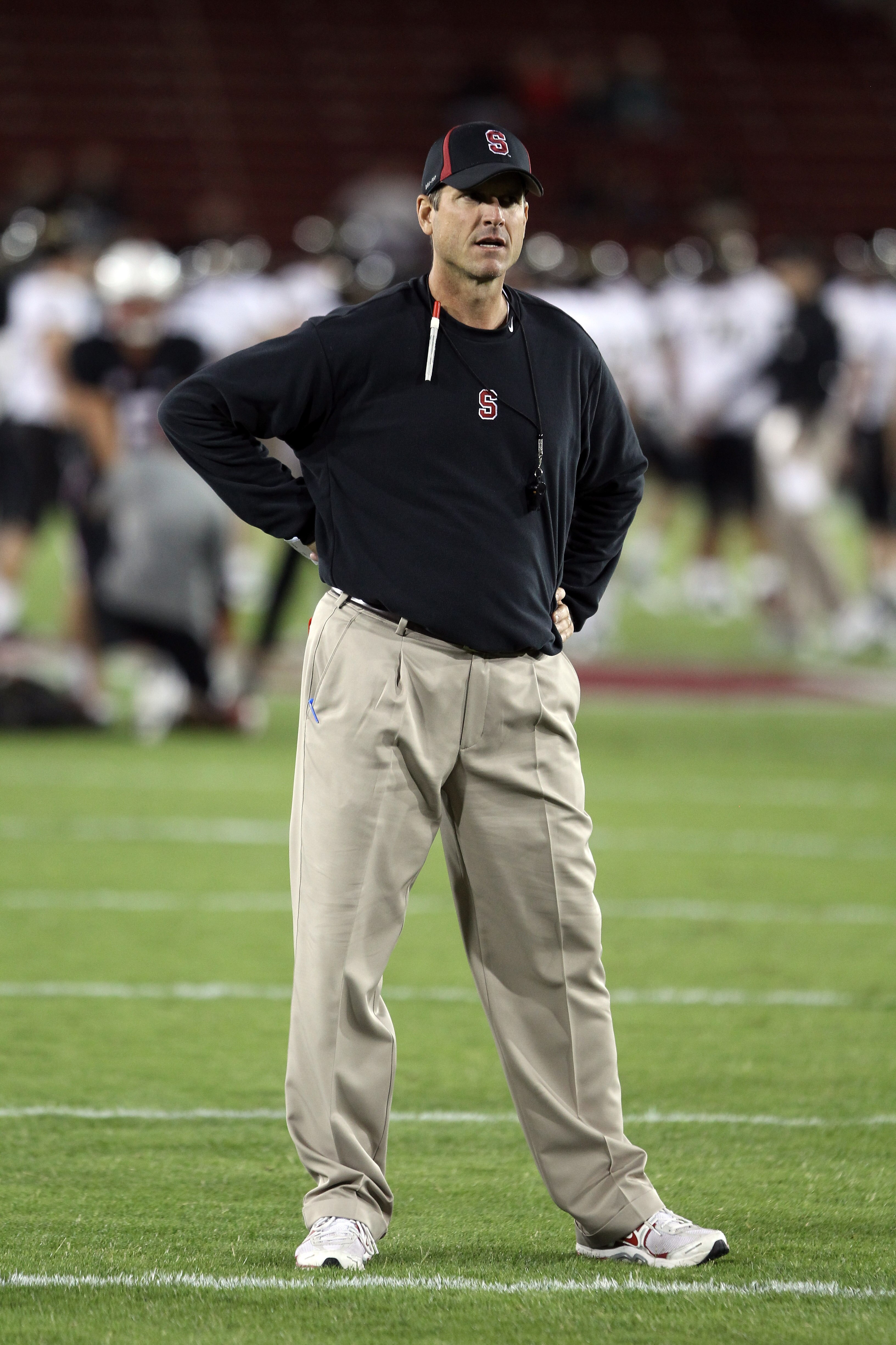 PALO ALTO, CA - SEPTEMBER 18:  Head coach Jim Harbaugh of the Stanford Cardinal watches his team warm up before their game against the Wake Forest Demon Deacons at Stanford Stadium on September 18, 2010 in Palo Alto, California.  (Photo by Ezra Shaw/Getty