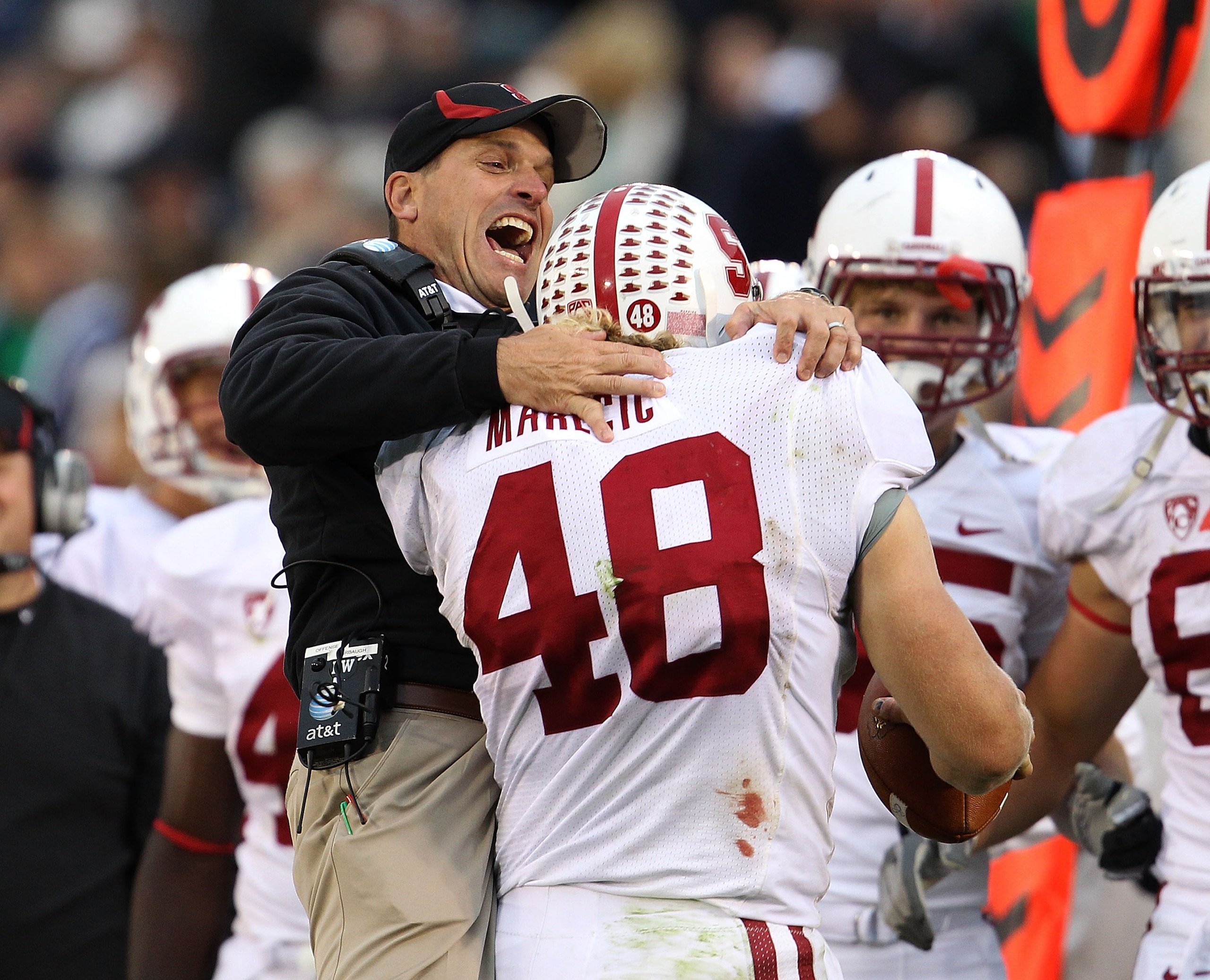 SOUTH BEND, IN - SEPTEMBER 25: Head coach Jim Harbaugh of the Stanford Cardinal jumps to greet Owen Marecic #48 after Marecic intercepted a pass for a touchdown against the Notre Dame Fighting Irish at Notre Dame Stadium on September 25, 2010 in South Ben