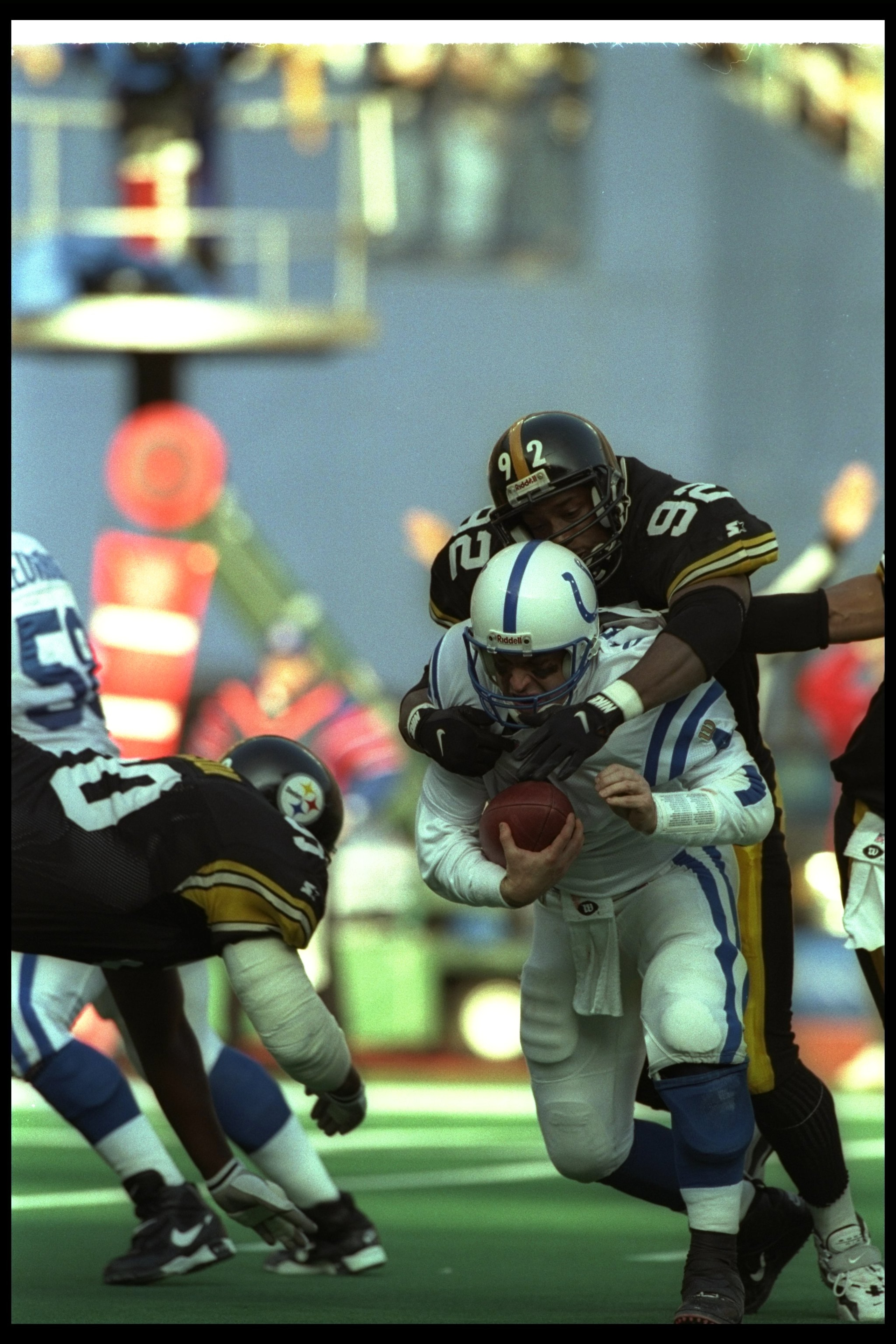 29 Dec 1996:  Linebacker Jason Gildon of the Pittsburgh Steelers tackles Indianapolis Colts quarterback Jim Harbaugh during a playoff game at Three Rivers Stadium in Pittsburgh, Pennsylvania.  The Steelers won the game, 42-14. Mandatory Credit: Jonathan D