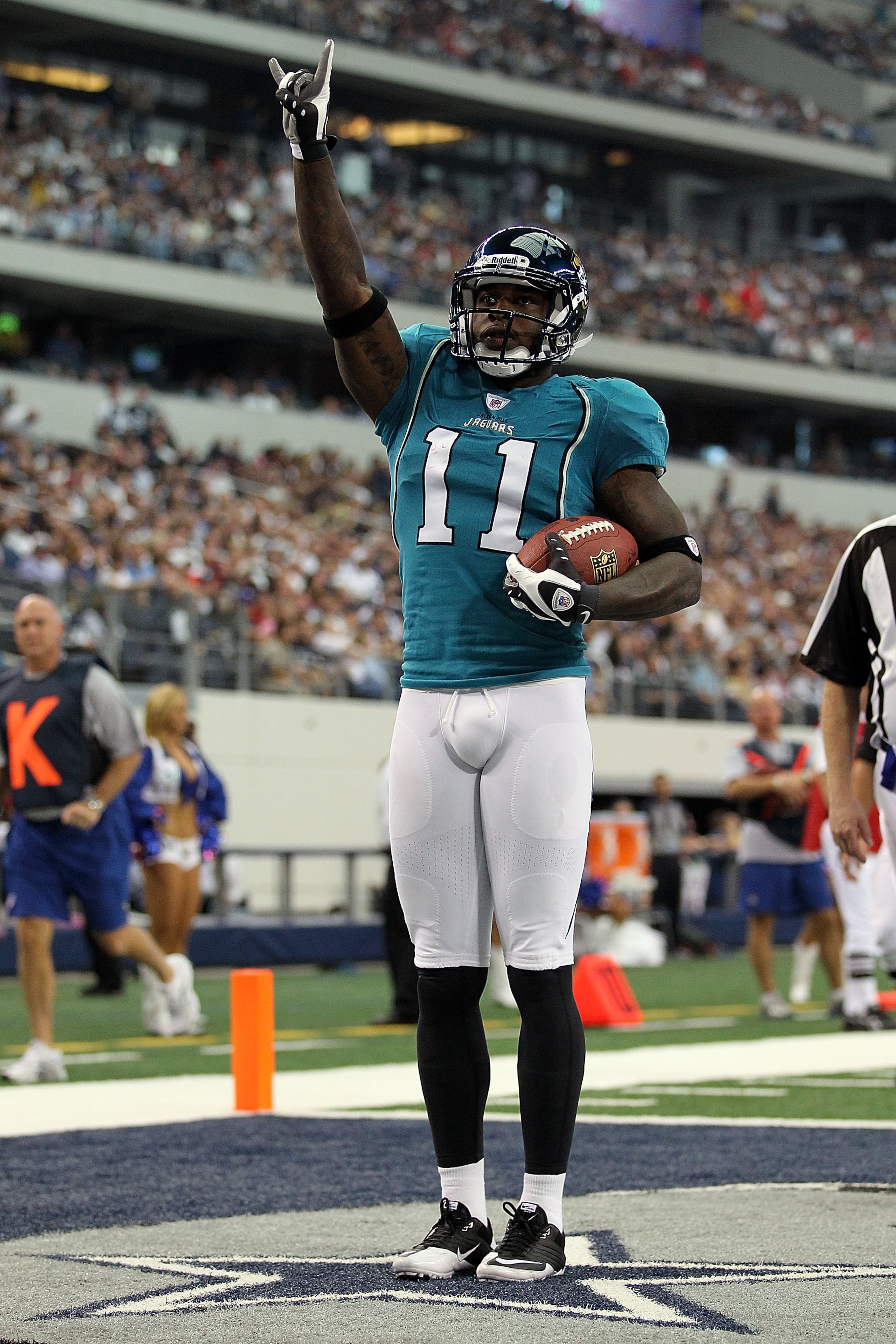 ARLINGTON, TX - OCTOBER 31:  Wide receiver Mike Sims-Walker #11 of the Jacksonville Jaguars celebrates a touchdown against the Dallas Cowboys in the first quarter at Cowboys Stadium on October 31, 2010 in Arlington, Texas.  (Photo by Ronald Martinez/Getty