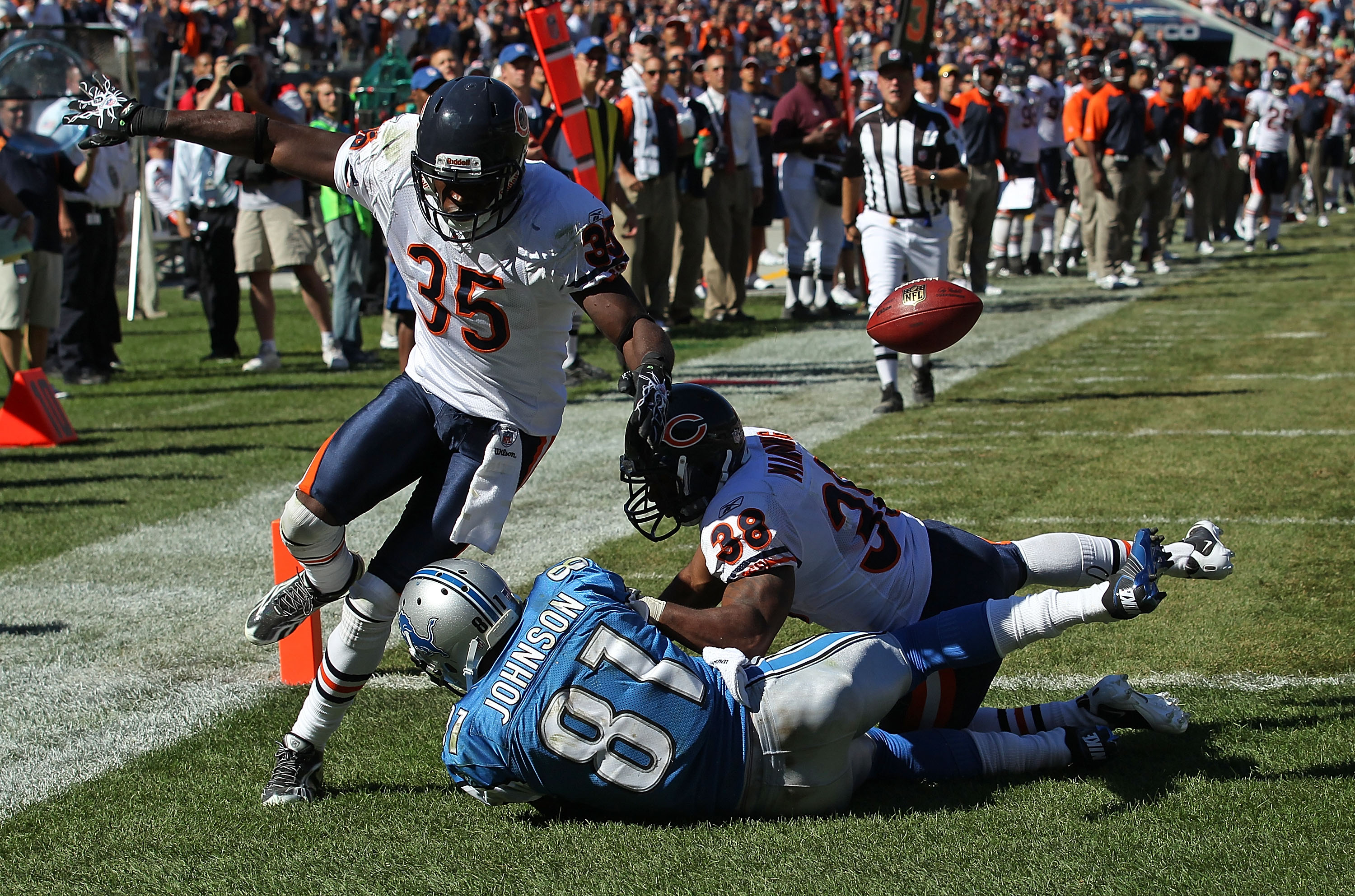 CHICAGO - SEPTEMBER 12: Zack Bowman #35 and Danieal Manning #38 of the Chicago Bears break up a pass intended for Calvin Johnson #81 of the Detroit Lions during the NFL season opening game at Soldier Field on September 12, 2010 in Chicago, Illinois. The B