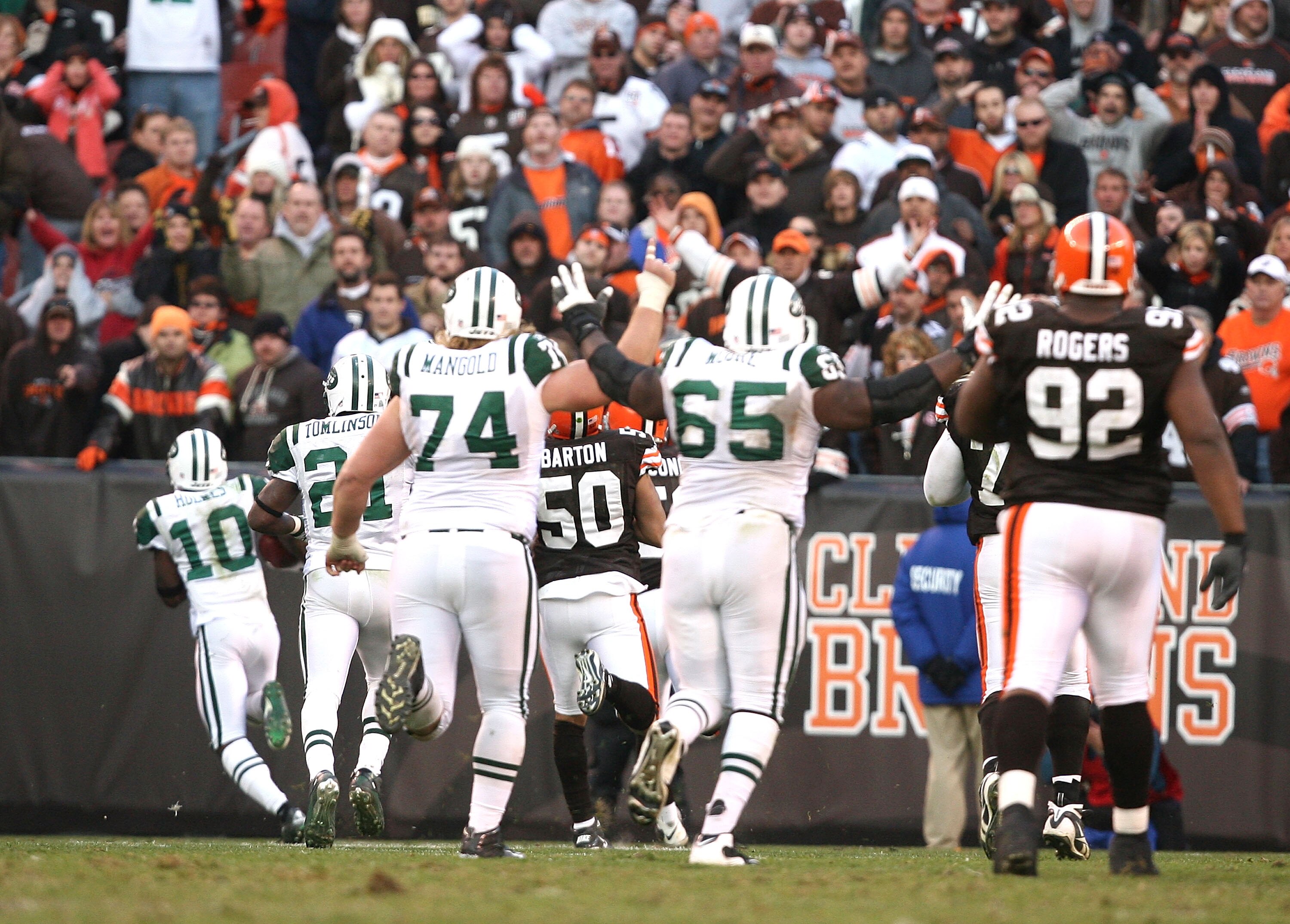 CLEVELAND - NOVEMBER 14:  Wide receiver Santonio Holmes #10 of the New York Jets scores a touchdown in overtime against the Cleveland Browns at Cleveland Browns Stadium on November 14, 2010 in Cleveland, Ohio.  (Photo by Matt Sullivan/Getty Images)