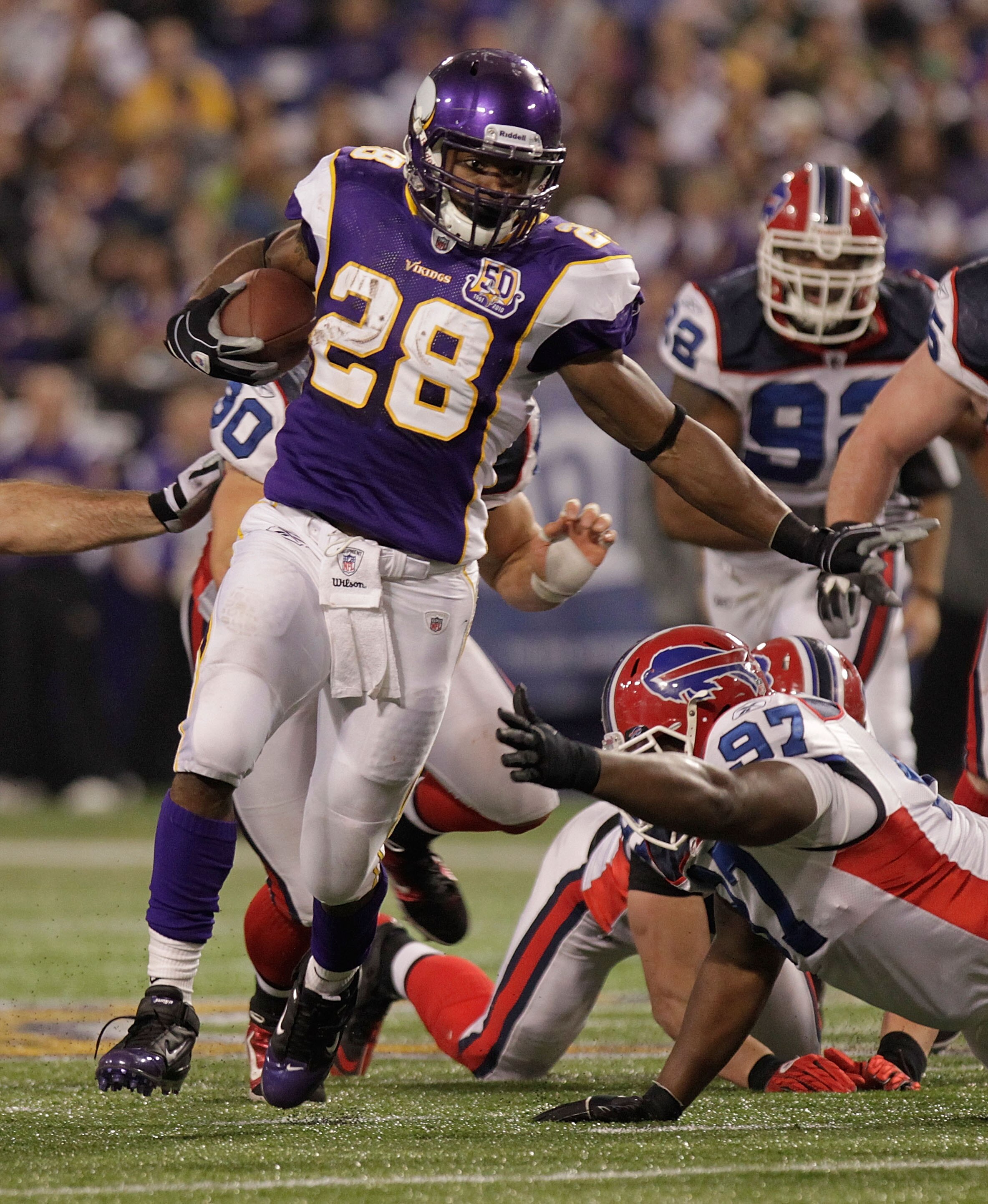 MINNEAPOLIS, MN - DECEMBER 05:  Adrian Peterson #28 of the Minnesota Vikings rushes against  the Buffalo Bills at the Mall of America Field at the Hubert H. Humphrey Metrodome on December 5, 2010 in Minneapolis, Minnesota.  (Photo by Nick Laham/Getty Imag